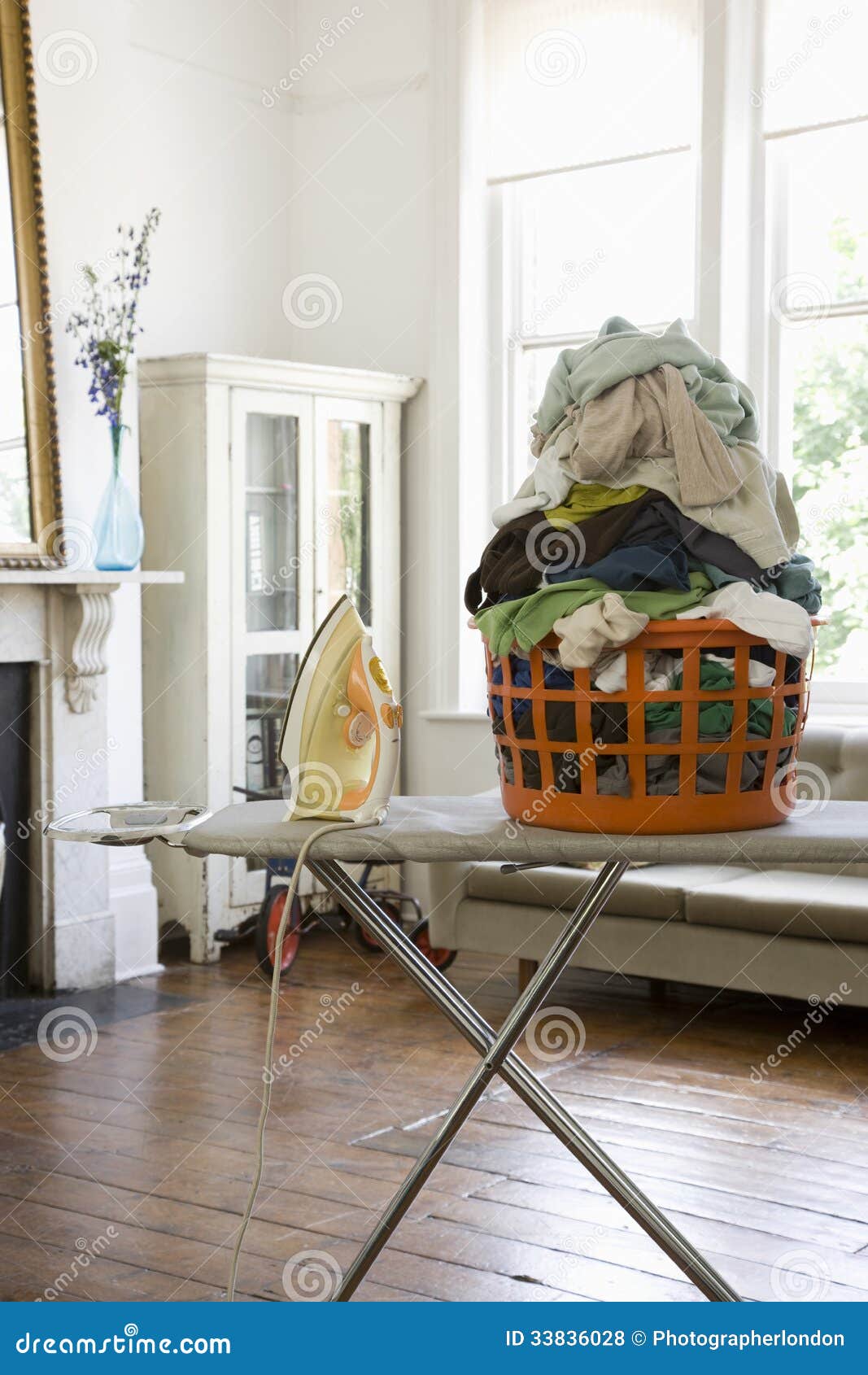 Laundry Basket and Iron on Ironing Board Stock Photo Image of pile