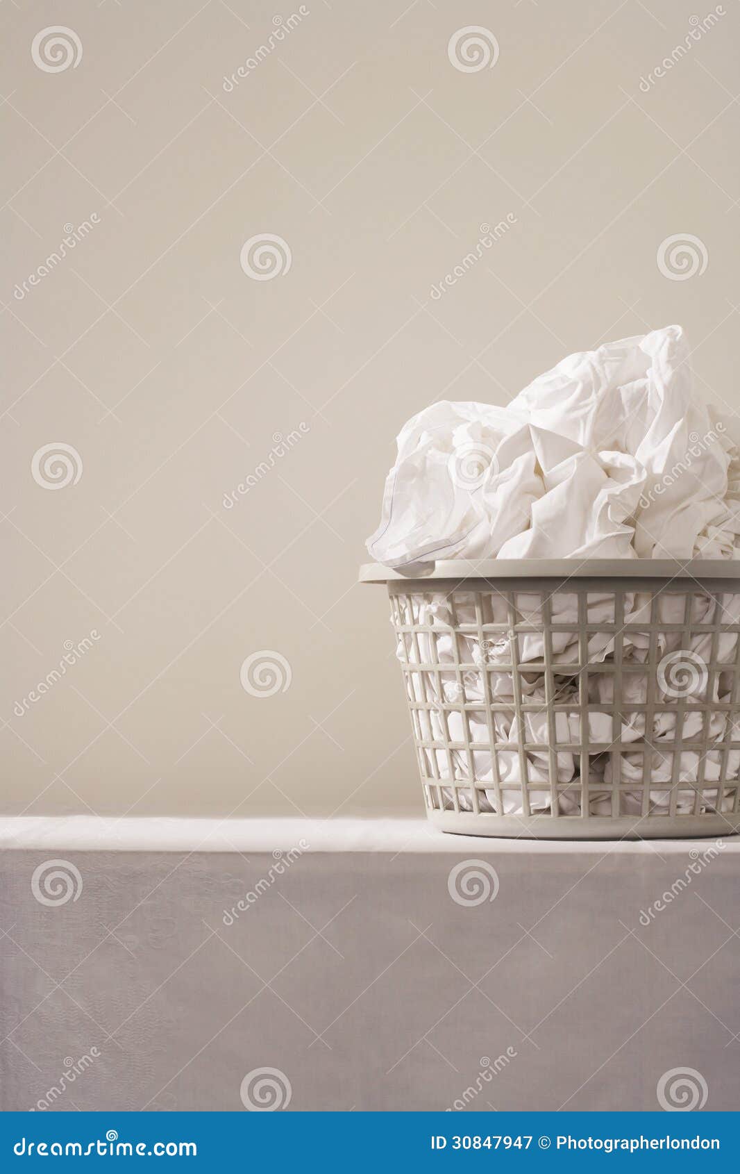 Laundry basket on table stock image. Image of london 30847947