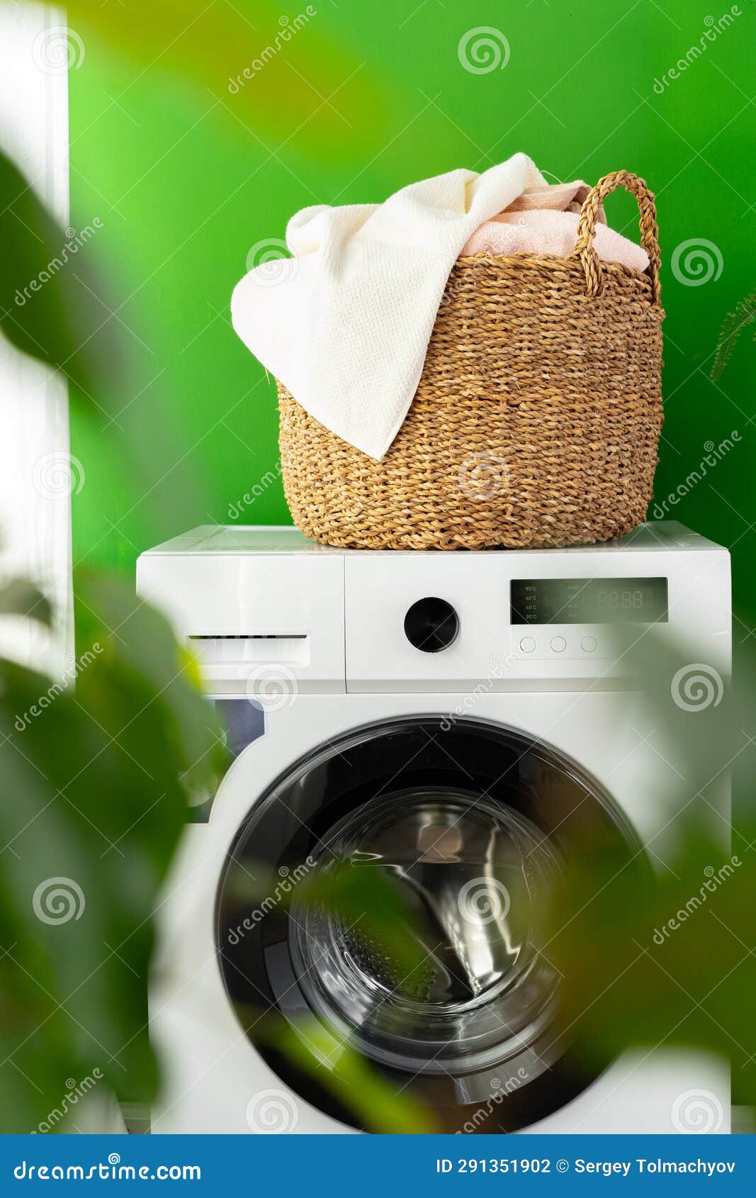 Laundry Basket on Washing Machine in a Laundry Room Stock Photo Image