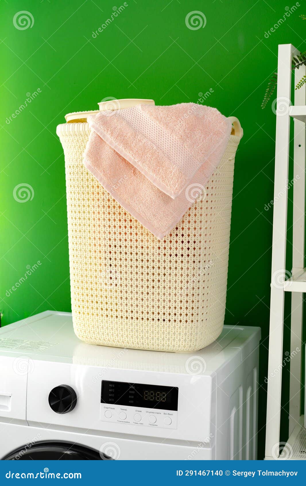 Laundry Basket on Washing Machine in a Laundry Room Stock Photo Image