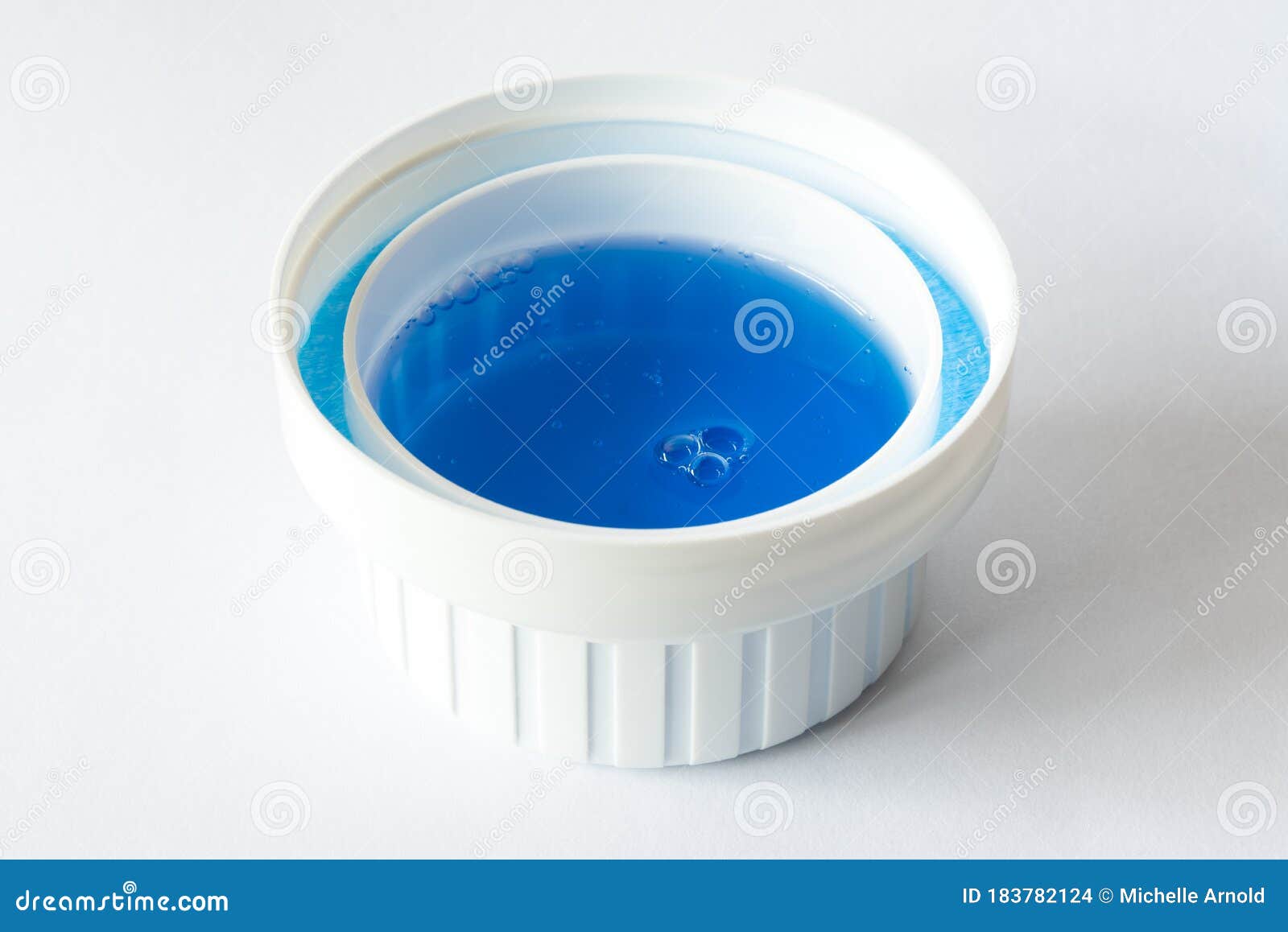 Laundry Detergent in a Cap stock photo. Image of capful 183782124