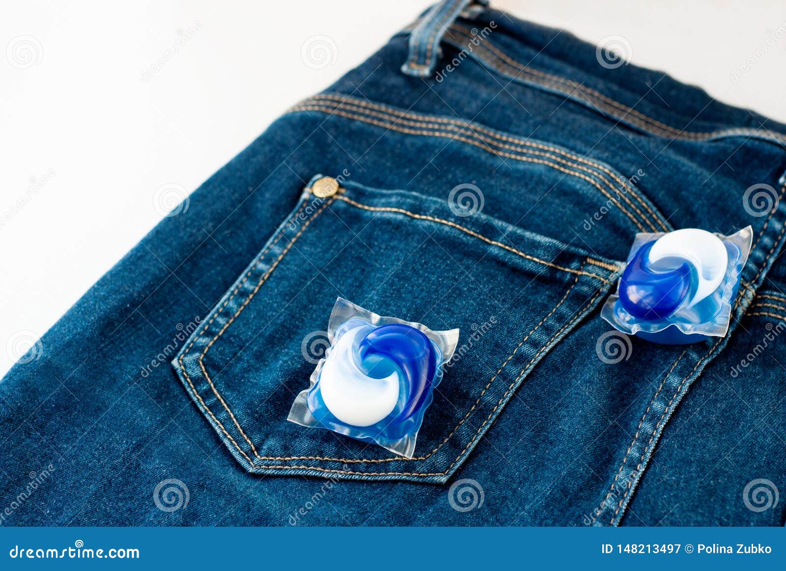 Laundry and Detergent Capsule Pod on Jeans Stock Image Image of