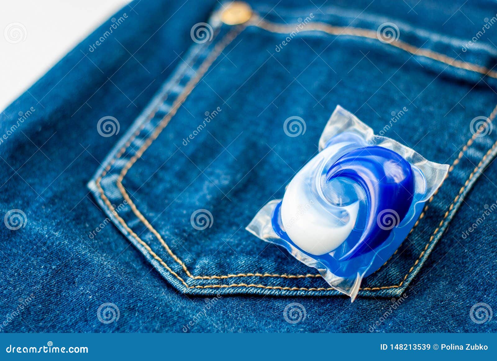 Laundry and Detergent Capsule Pod on Jeans Stock Image Image of