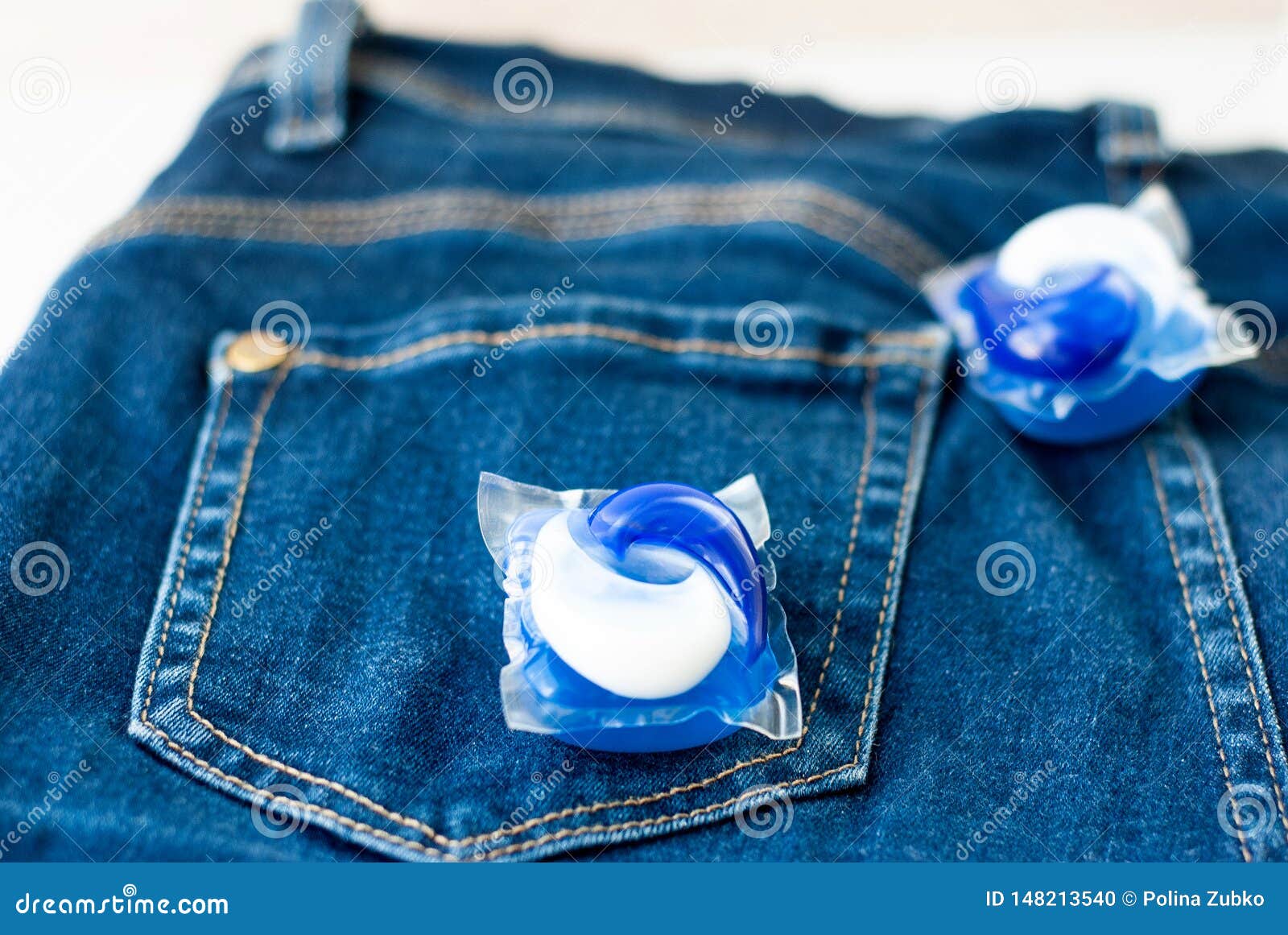 Laundry and Detergent Capsule Pod on Jeans Stock Photo Image of