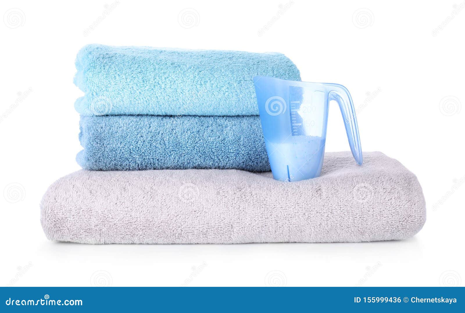 Laundry Detergent in Measuring Cup and Towels on White Background Stock Photo Image of powder