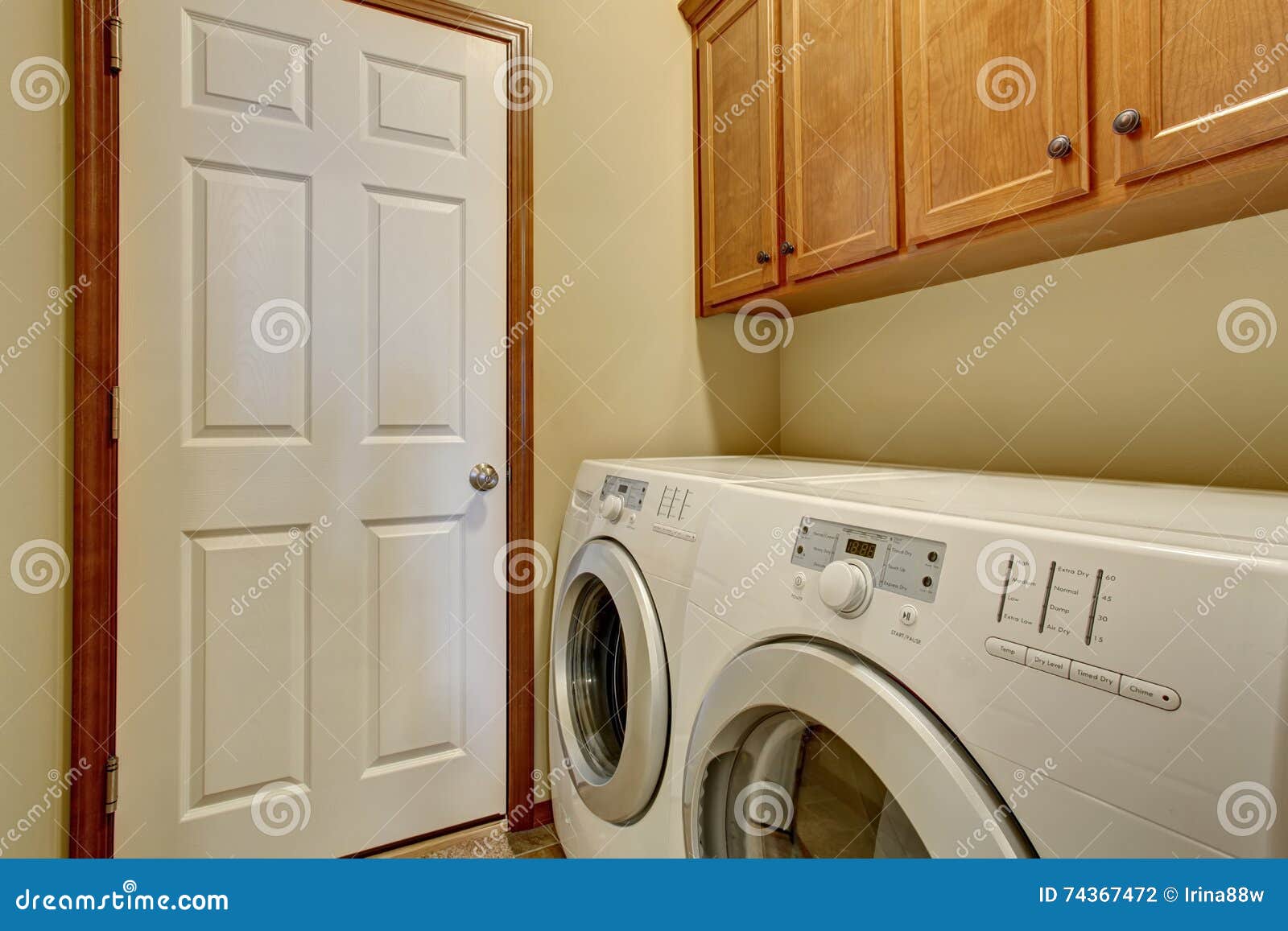 Laundry Room with White Appliances and Light Tone Stock Photo