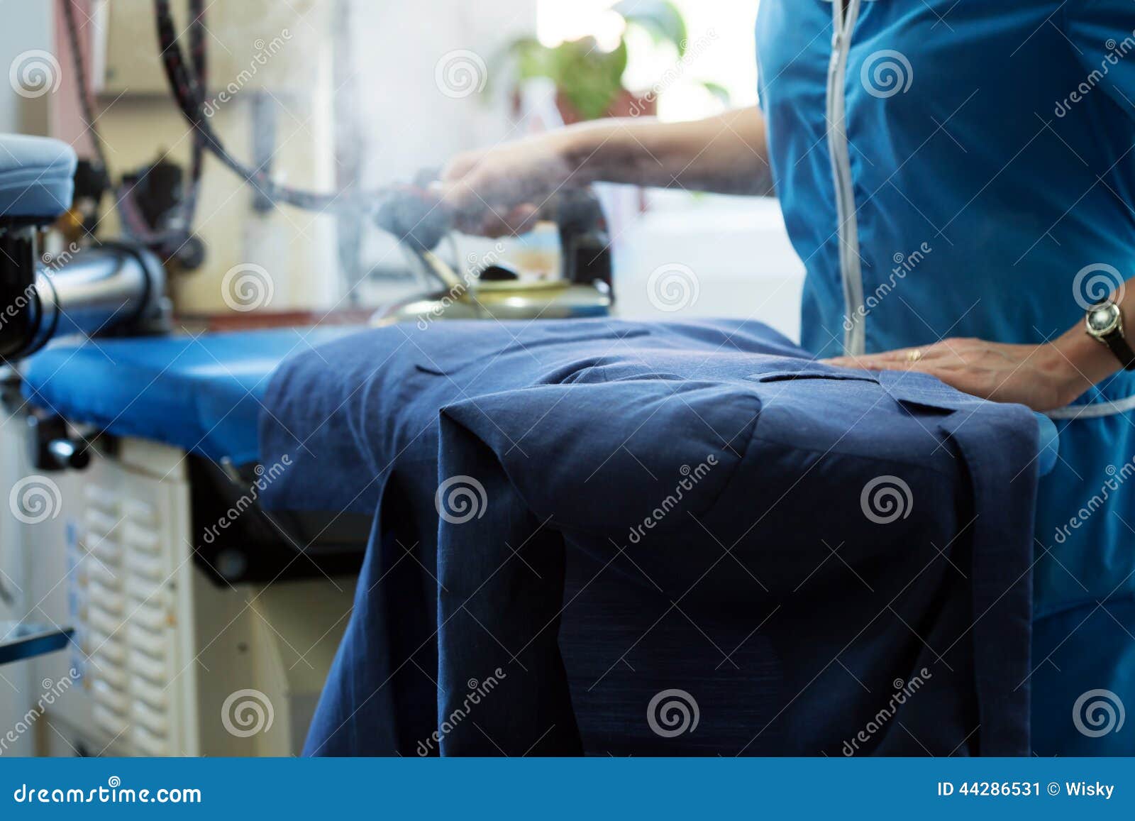 Laundry Worker Steaming Jacket on Ironing Board Stock Image Image of