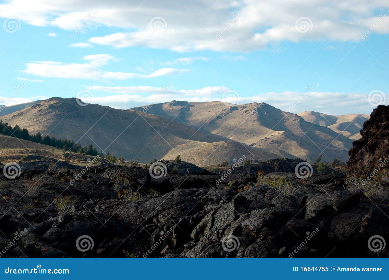 Lava and Mountains. Rough black lava turns to soft rolling mountains.