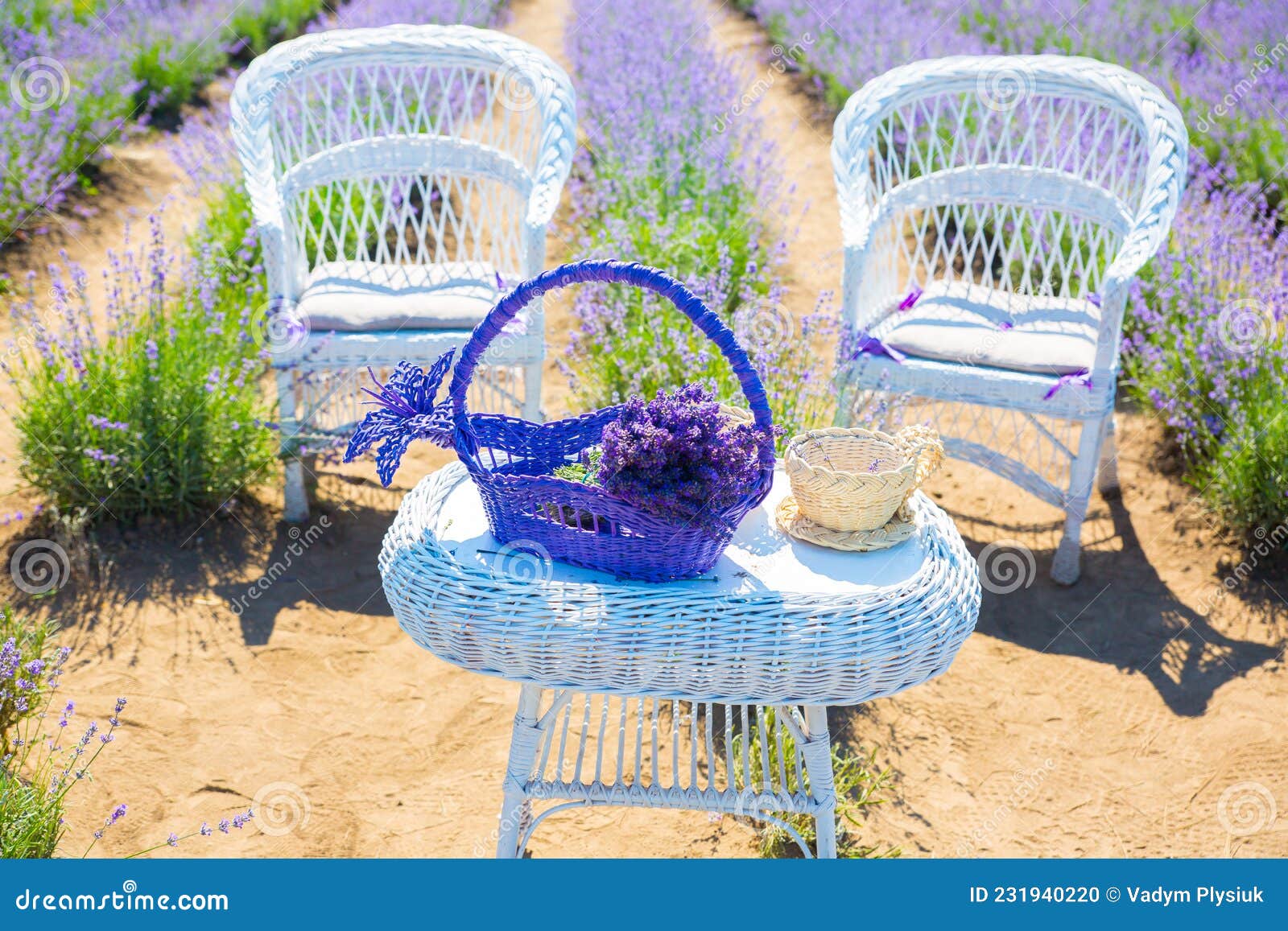 Wicker Chair And Baskets With Fresh And Dry Lavender Flowers In The Room  Next To It Is A Table With Vases And Candles Romantic Interior Of The Room  Tinted Photo High-Res Stock