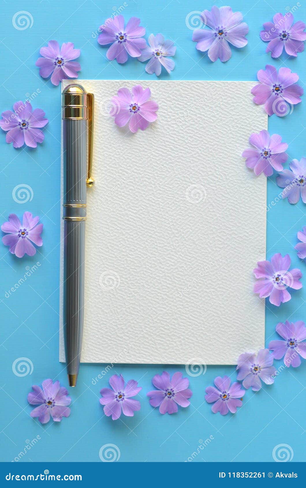 lavender violet phlox flowers on turquoise teal blue flat layout with copy space