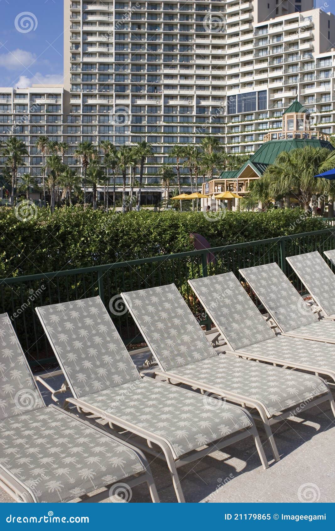 Lawn chairs at a hotel stock image. Image of chairs, building 21179865