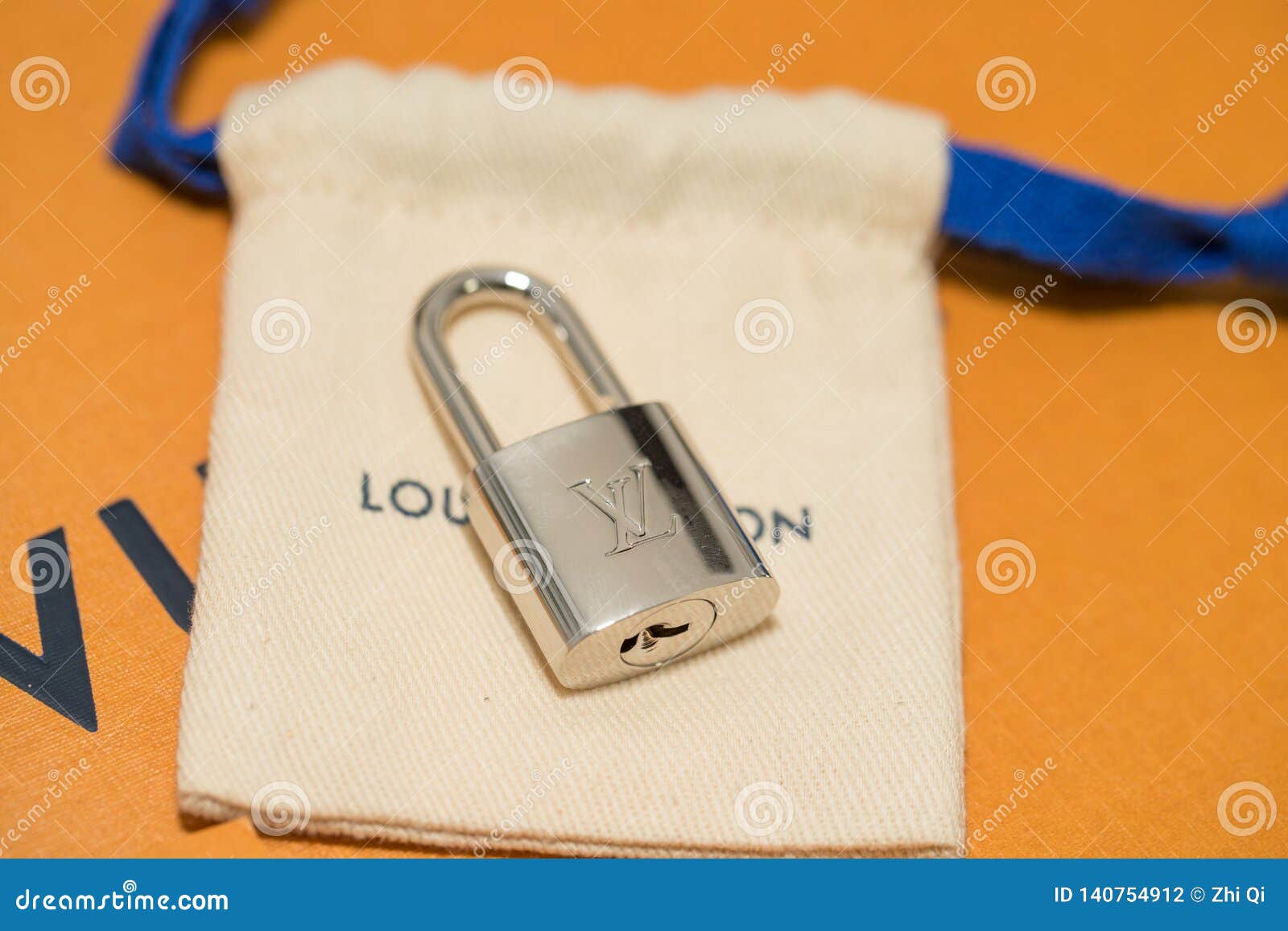 Louis Vuitton Lock on the Table. Editorial Photography - Image of
