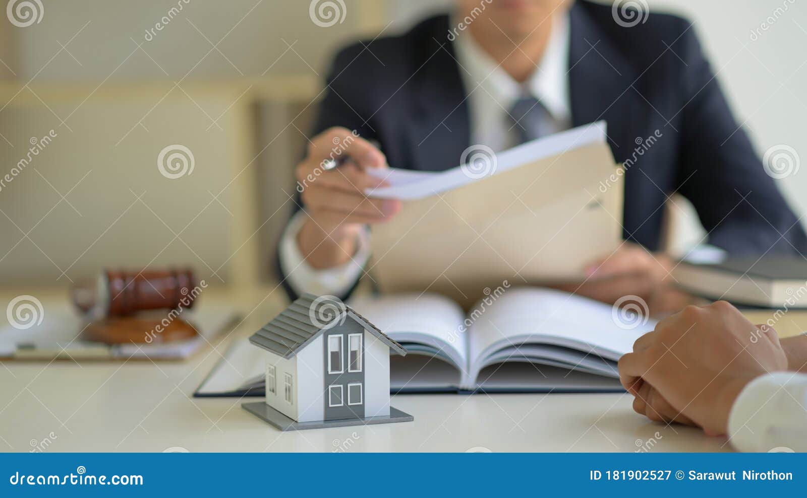 The Lawyer is Consulting Clients about the House Purchase Contract