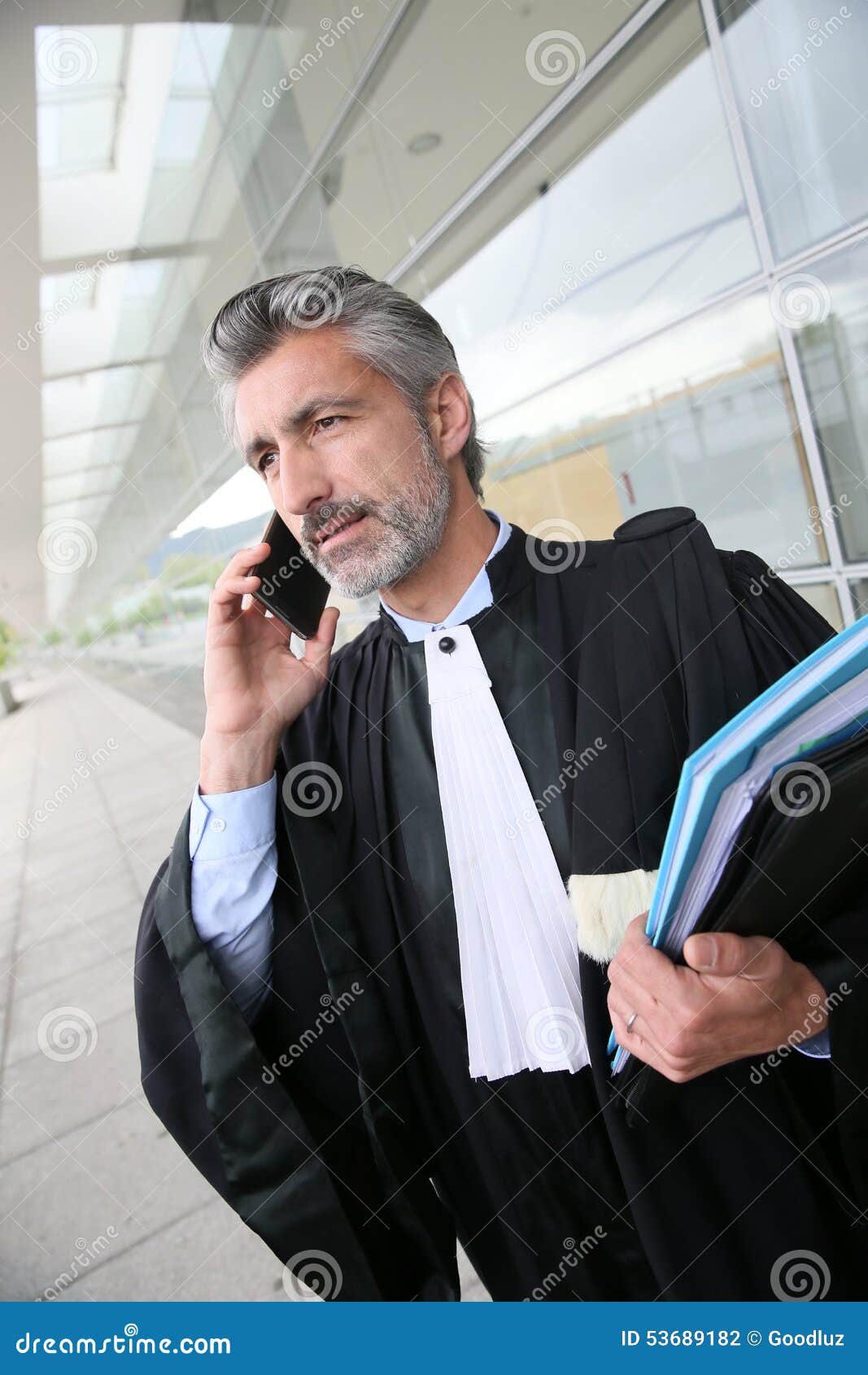 Lawyer in Front of the Courthouse Talking on the Phone Stock Photo