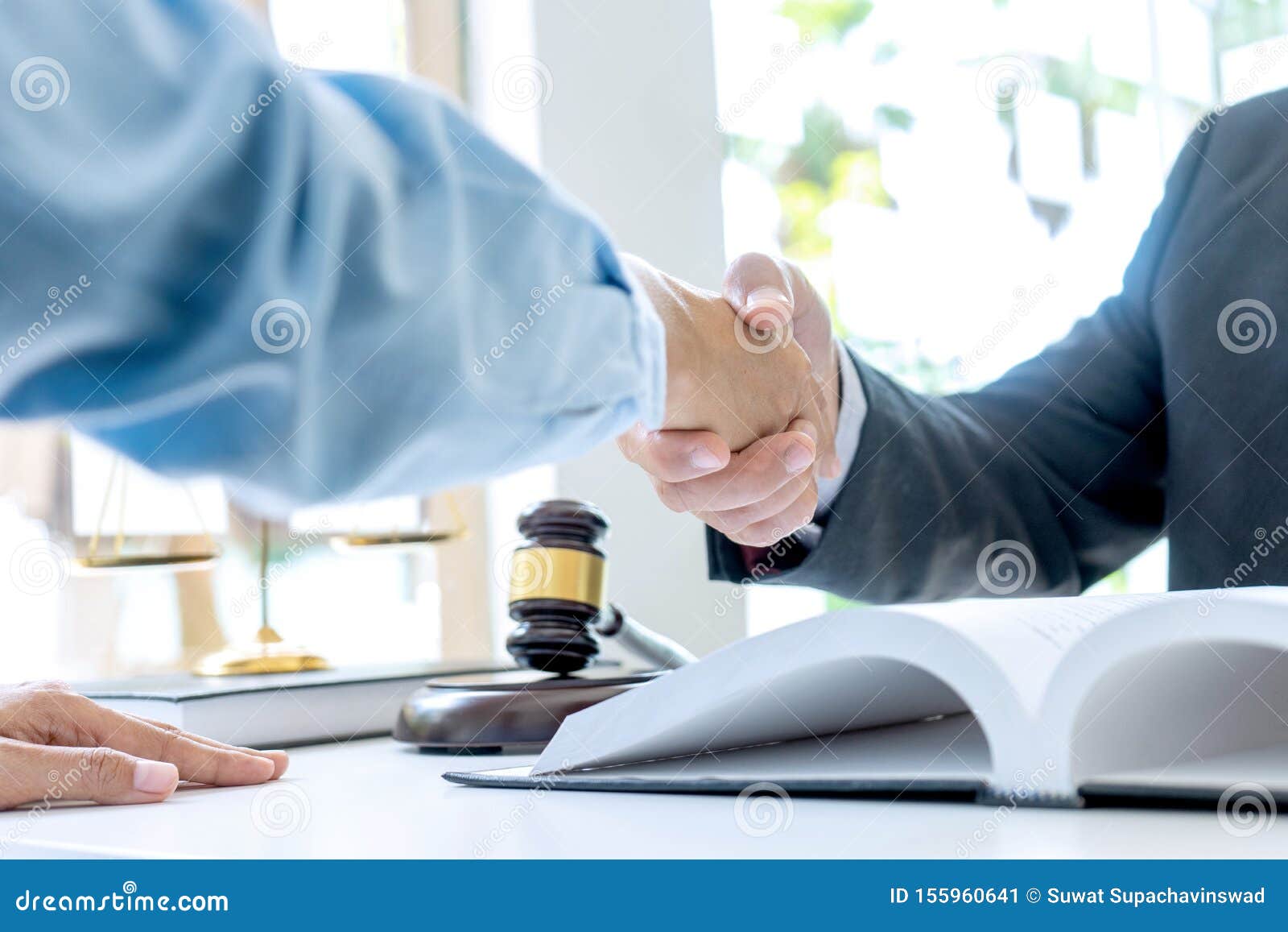 lawyer or judge  with gavel and balance handshake