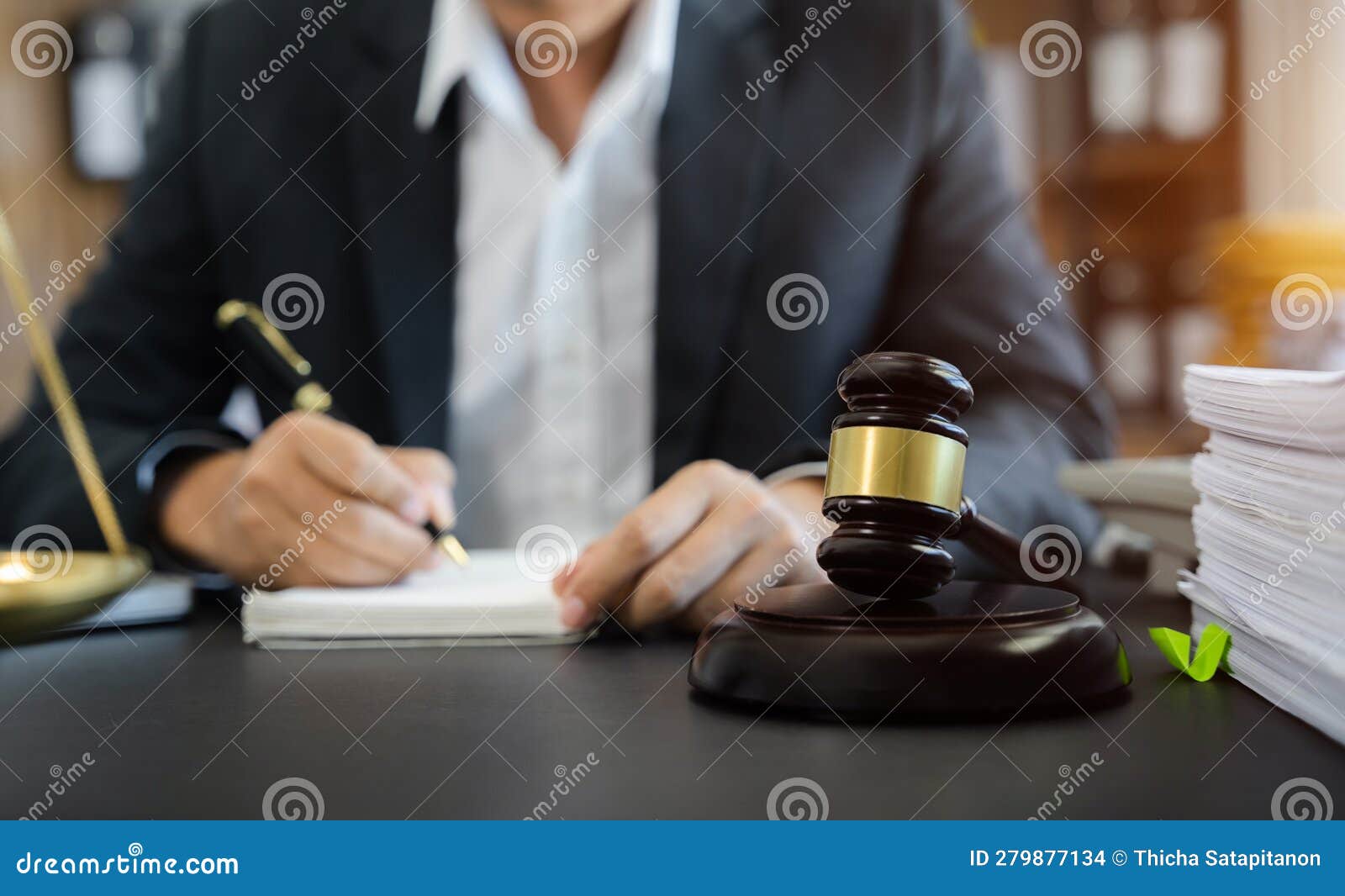Lawyer in Office. Businessmen Sitting at Desk and Making Notes Stock