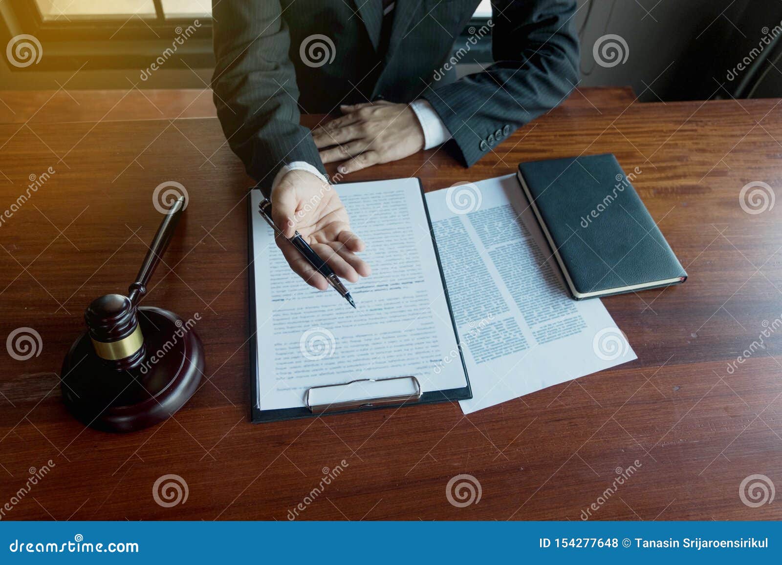 lawyer present client with contract papers on the table in office. consultant lawyer, attorney, court judge, concept