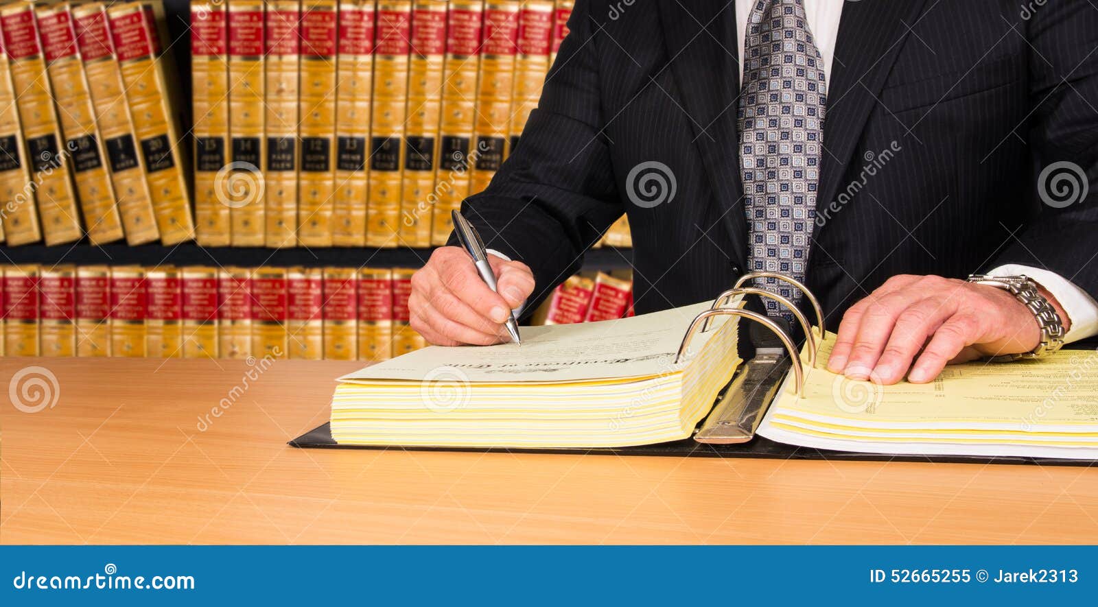 lawyer signing legal documents