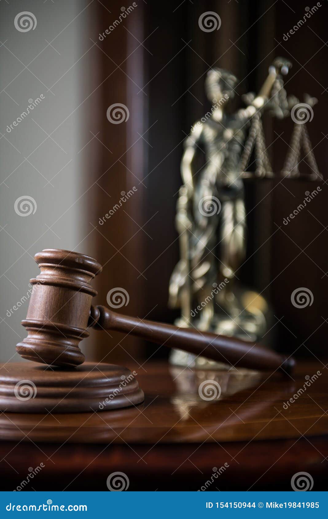 wooden gavel on wooden table,legal books background