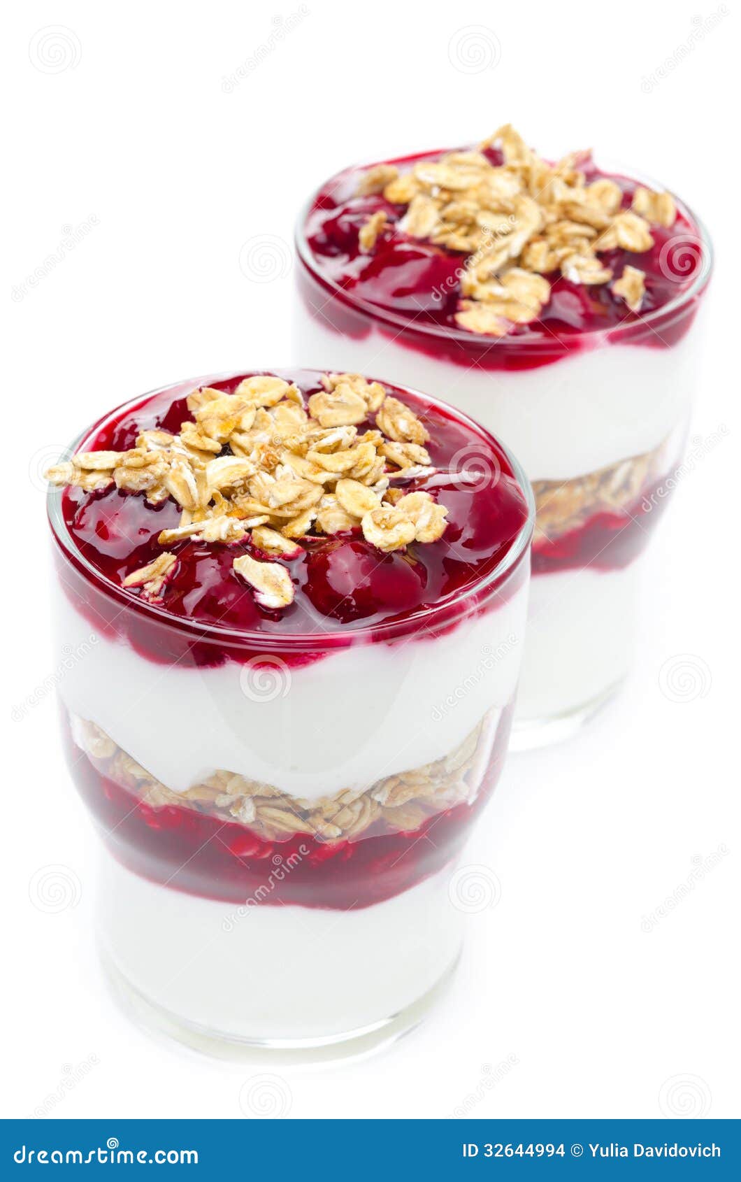 Layered Dessert Made of Yogurt, Granola and Cherry on White Stock Photo