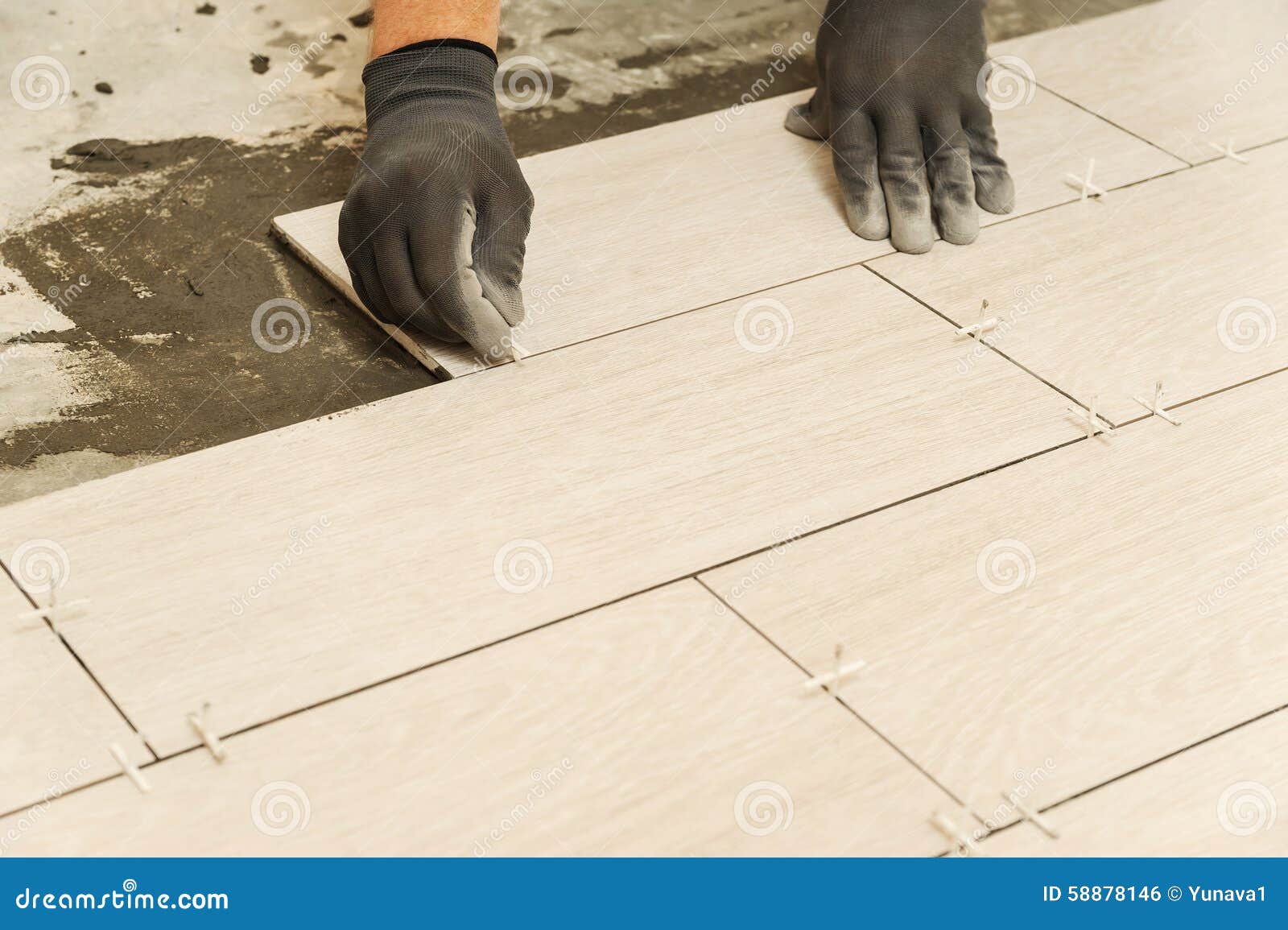 Laying Ceramic Tiles stock photo. Image of professional 58878146