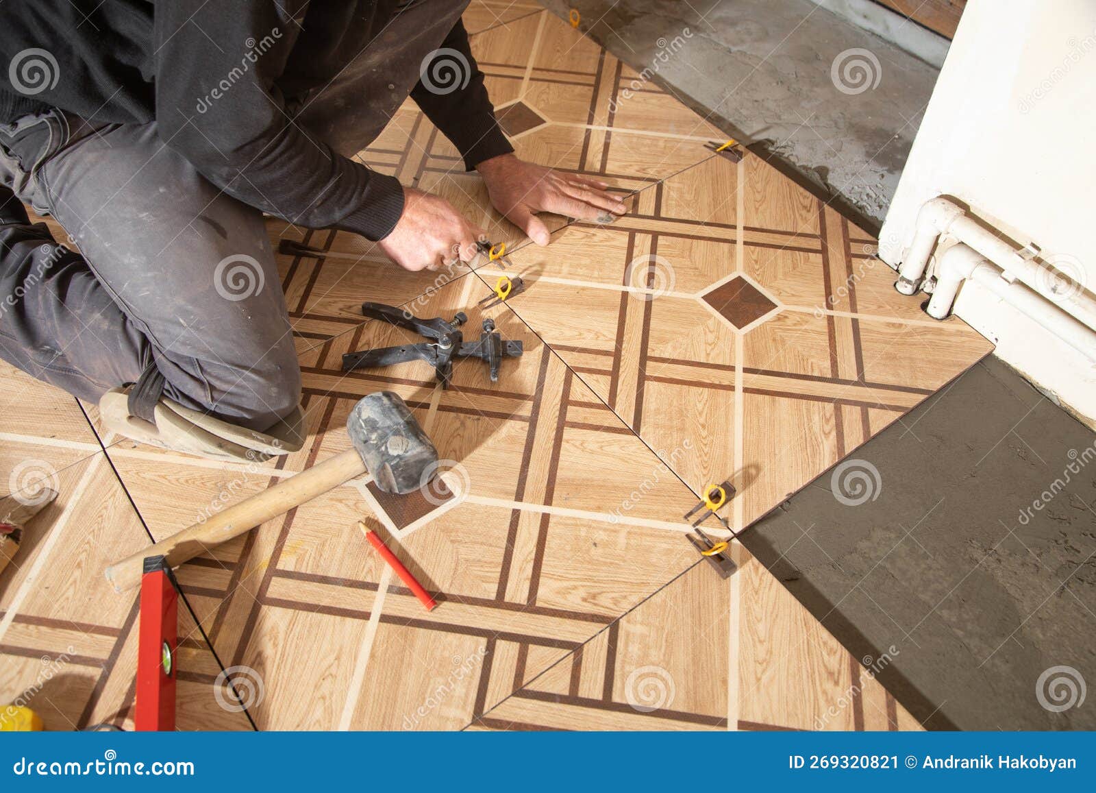 Laying Floor Ceramic Tile. Renovating the Floor Stock Image Image of