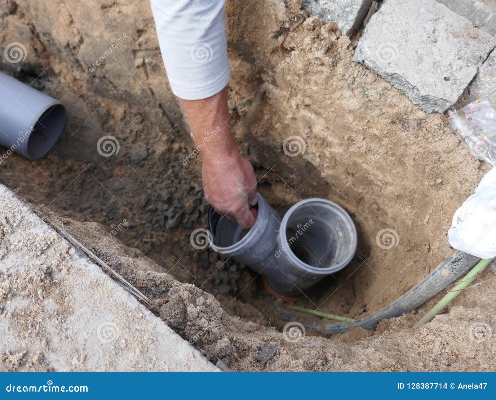 Laying and Installation of a Sewer Pipe Stock Photo Image of hand