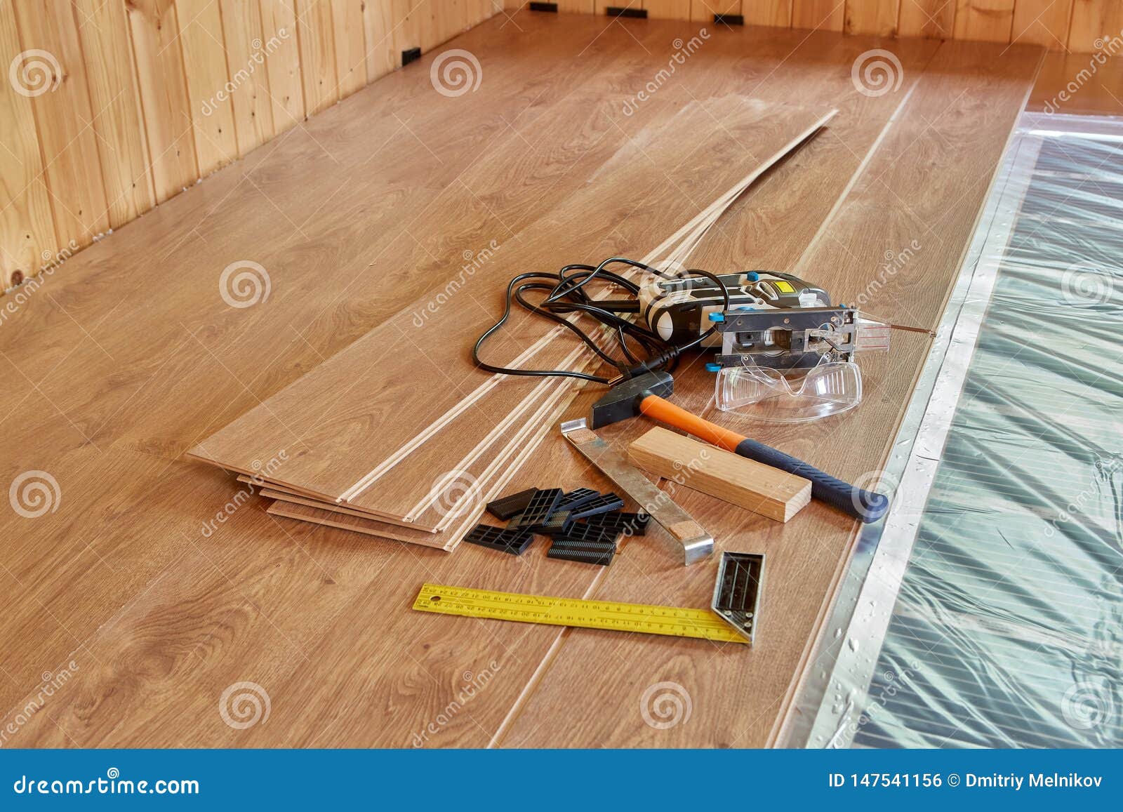 Laying Laminate Covering On Heat Insulated Floor Stock Photo