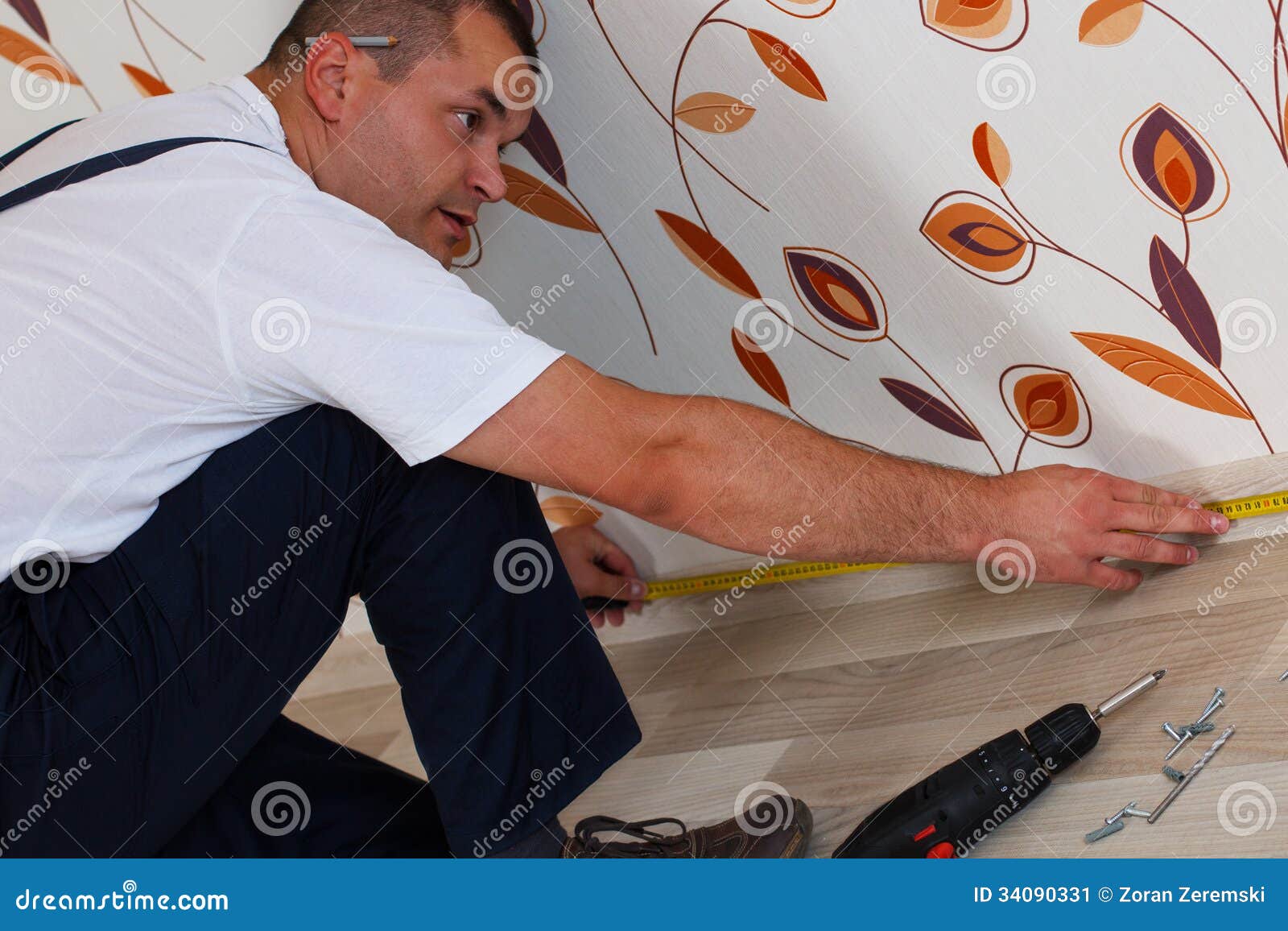 Laying laminate flooring stock image. Image of improvement 34090331