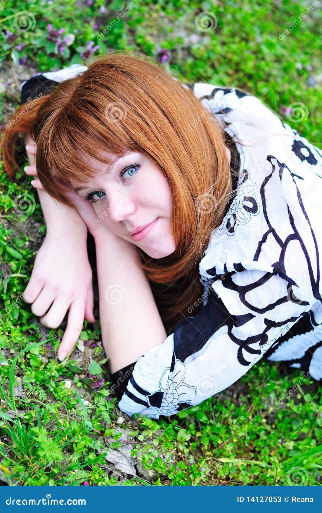 laying spring redheaded girl