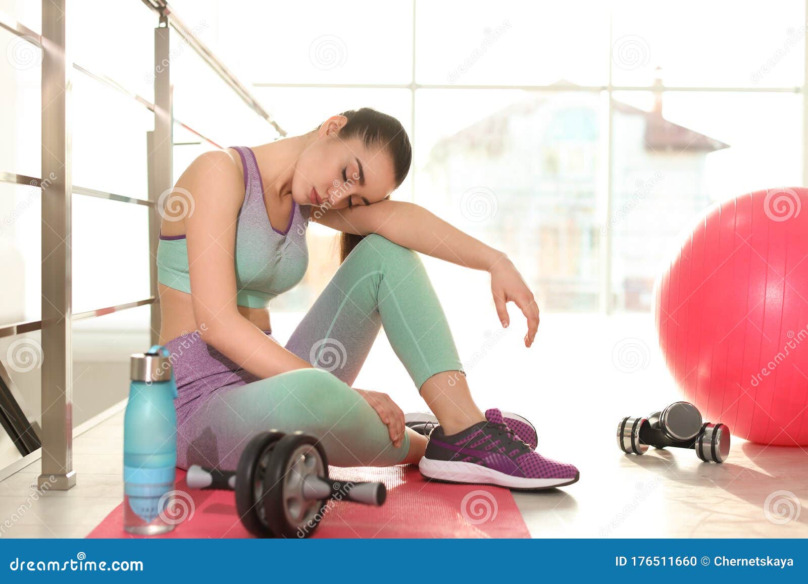 Lazy Young Woman with Sport Equipment on Yoga Mat Stock Photo - Image ...