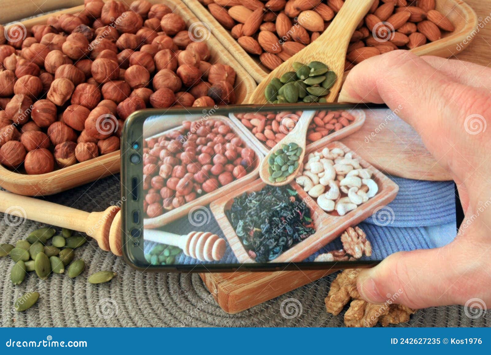 Leafy green tea and nuts stock image. Image of closeup 242627235