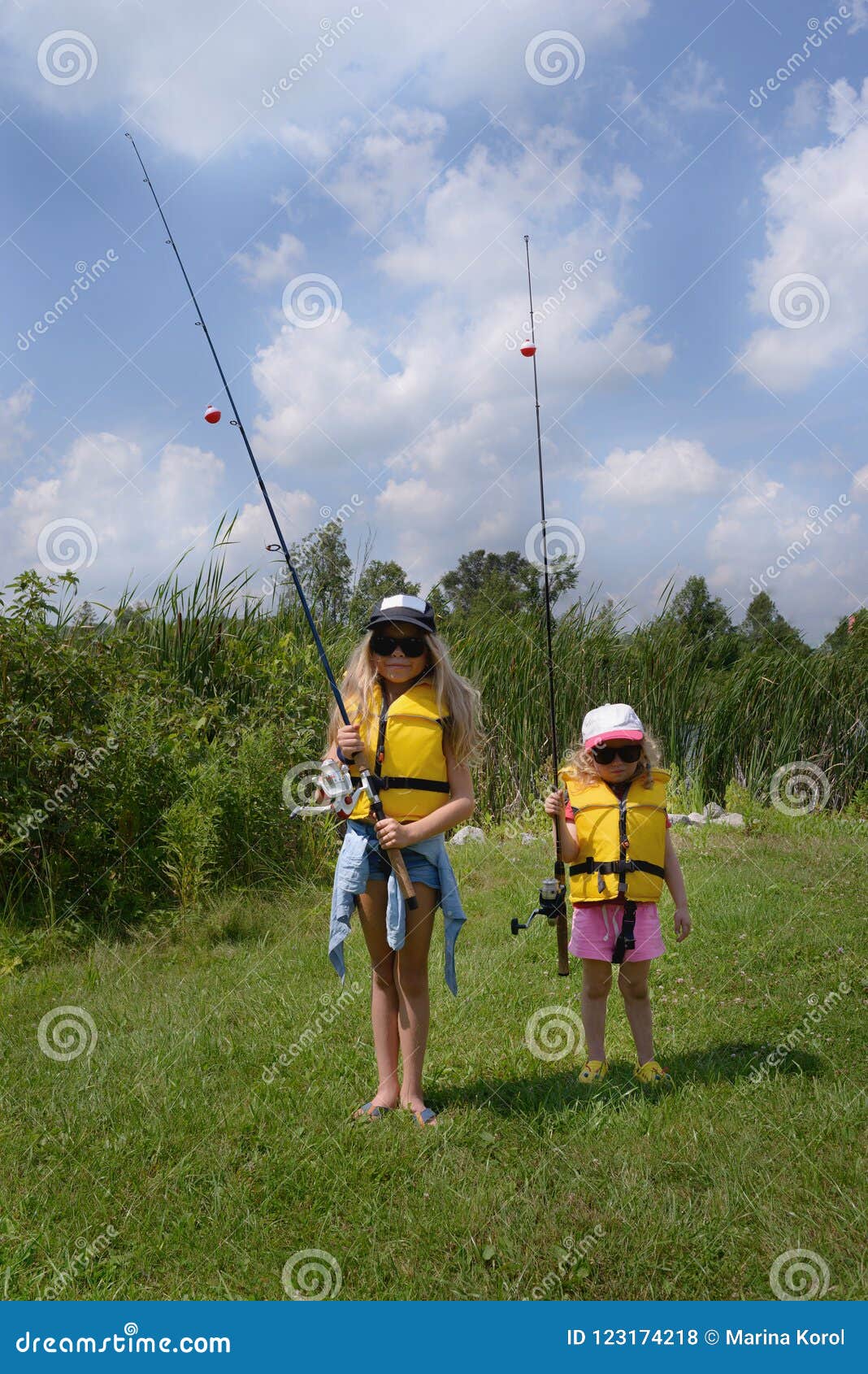 Learn To Fish. Two Amazing Blonde Little Girl with Fishing Rod are