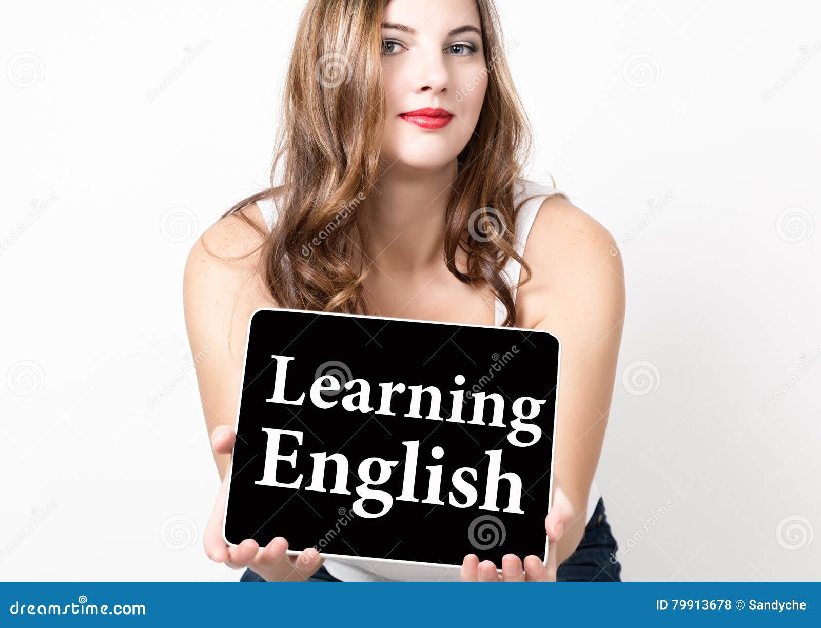learning english written on virtual screen. technology, internet and networking concept. beautiful woman with bare