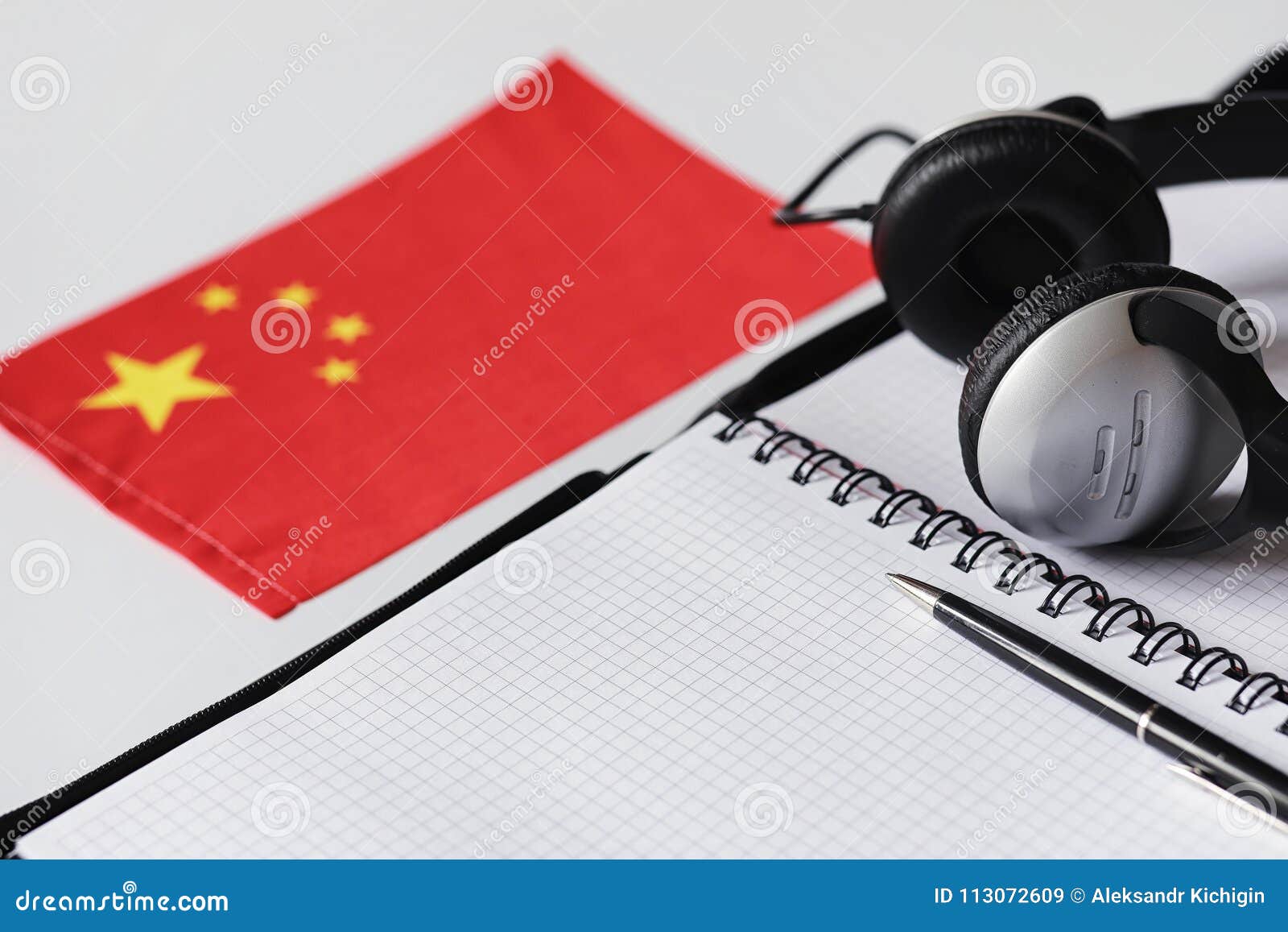Learning Foreign Languages. Notepad for Entries and a Flag Stock Image