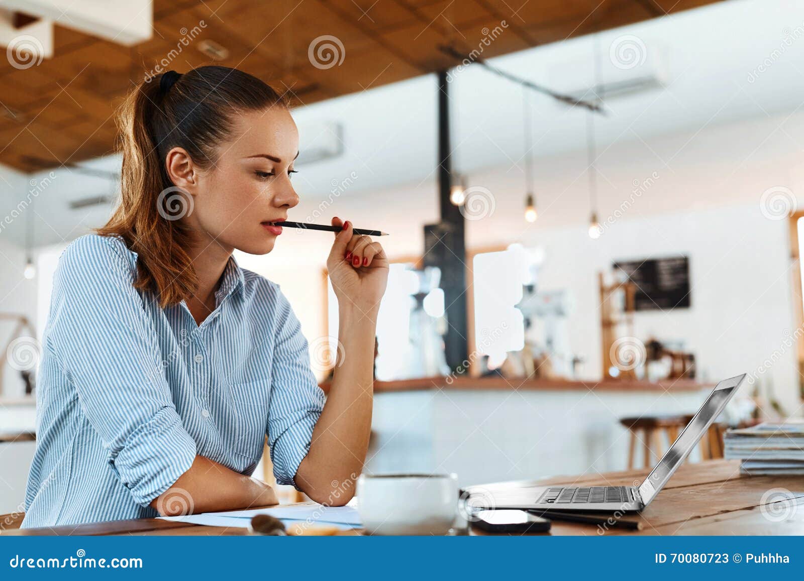 learning, studying. woman using laptop computer at cafe, working