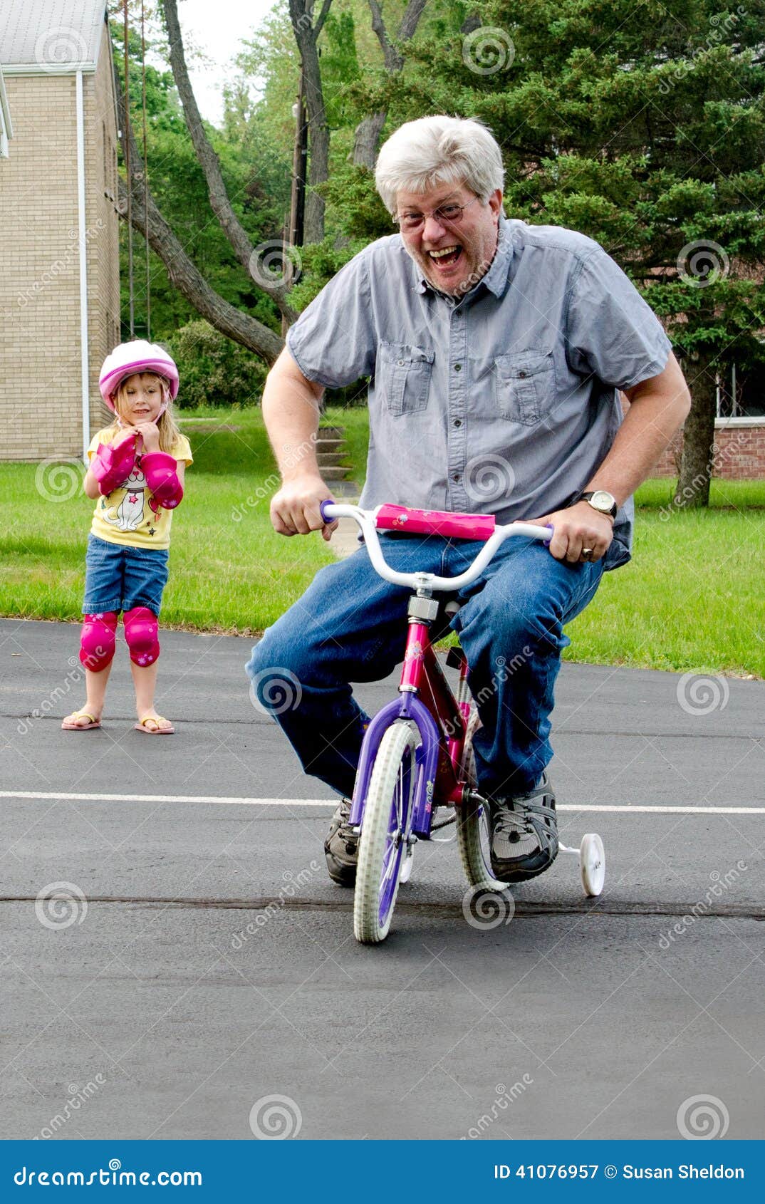 Ride A Bike With Training Wheels Stock 