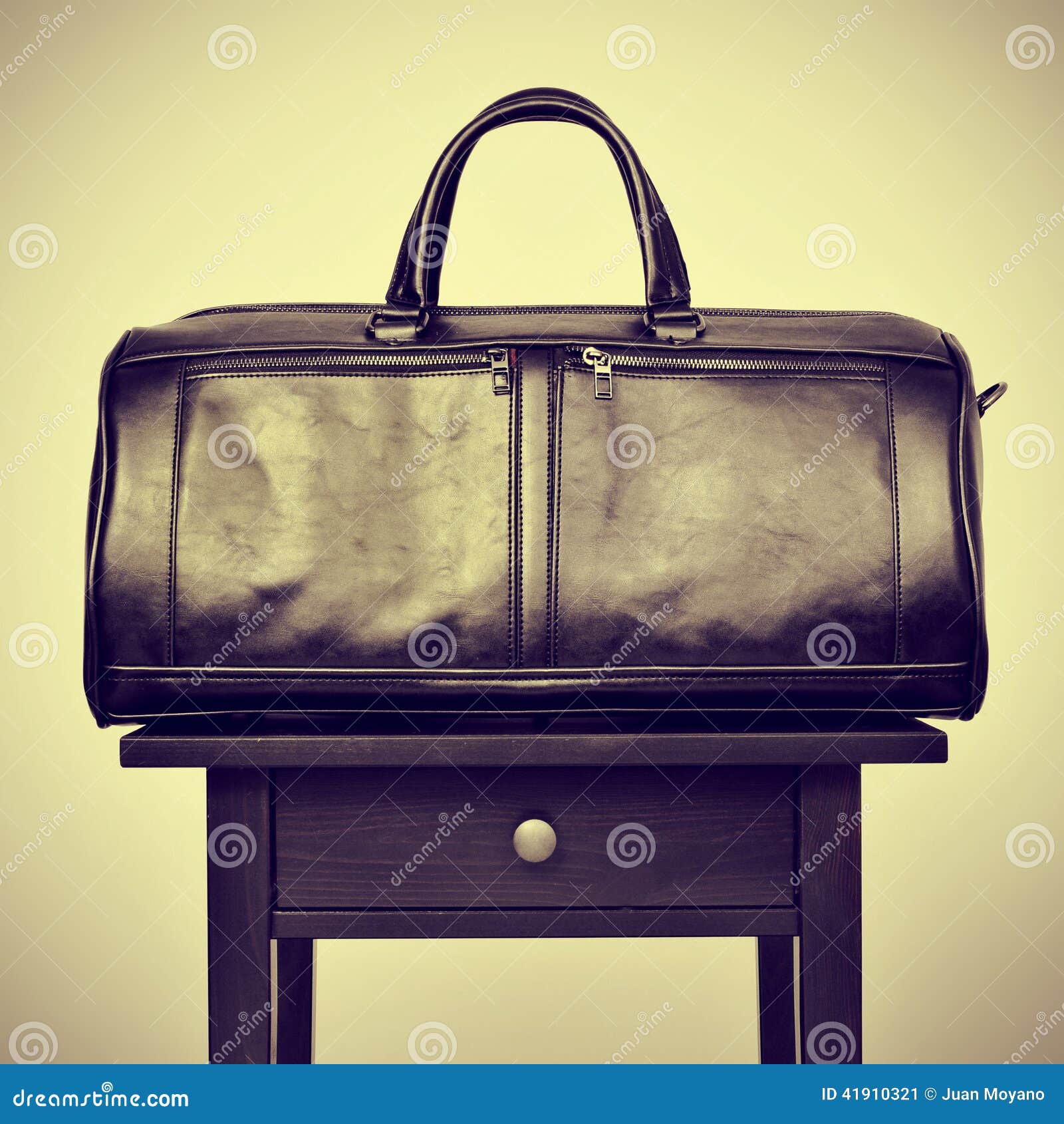 Leather bag on a table stock image. Image of filter, migrate 41910321