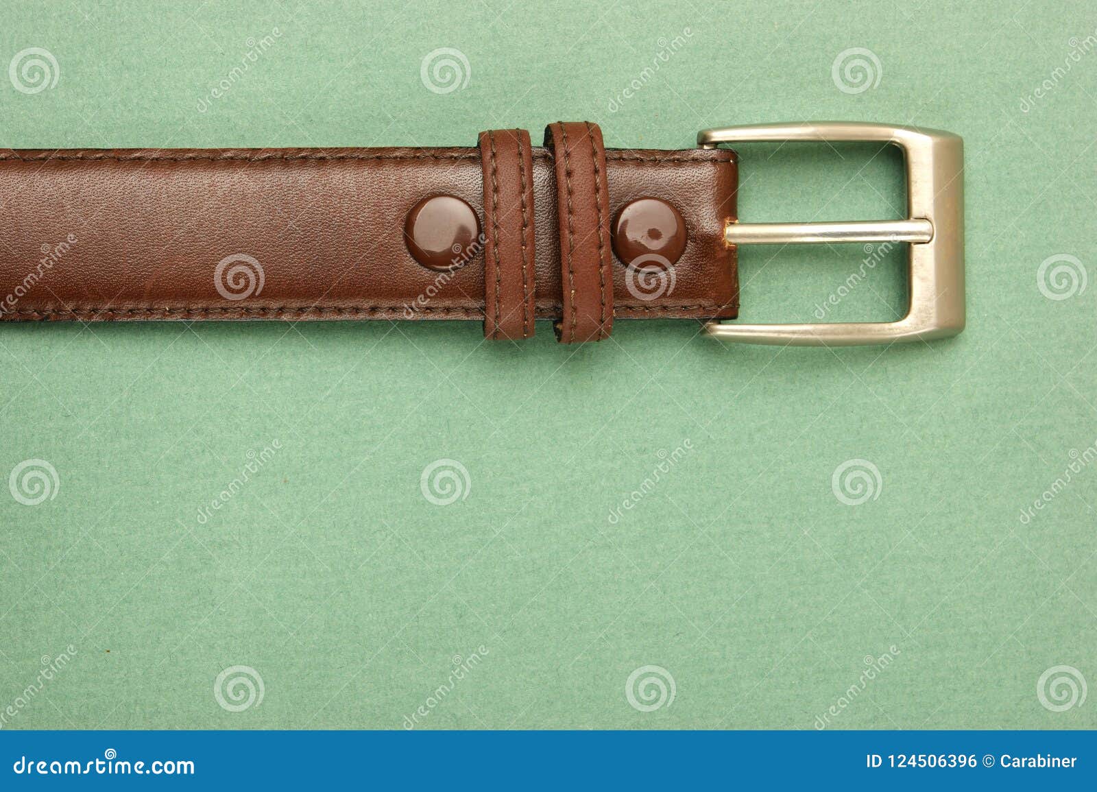 Leather Belt with a Buckle on a Green Stock Photo - Image of hide ...