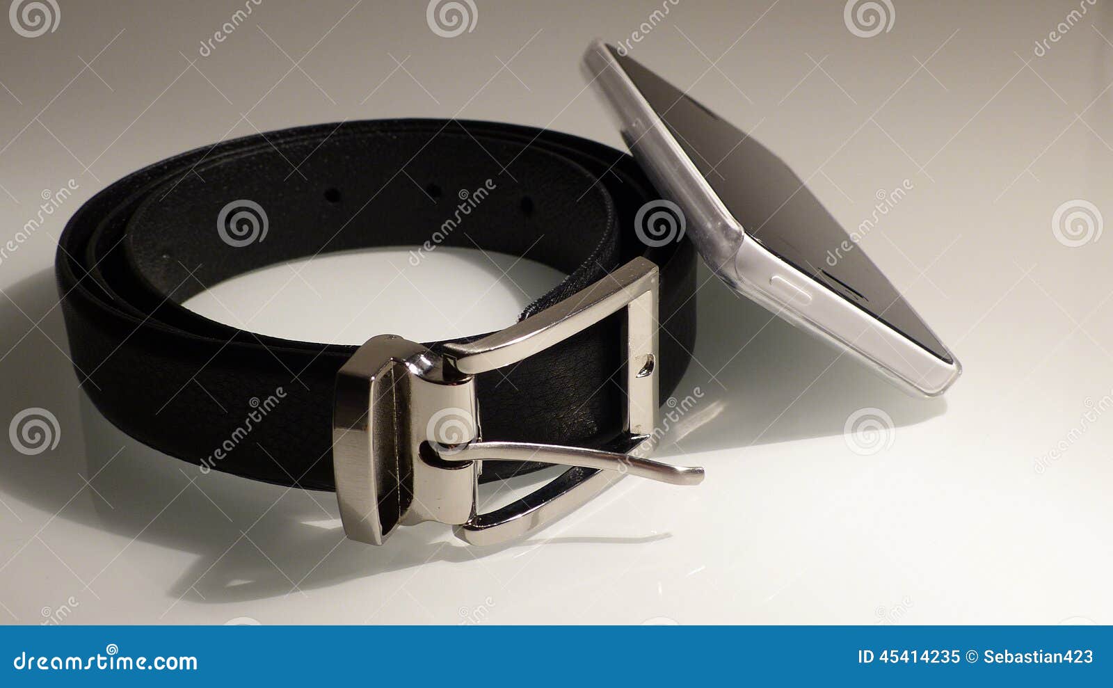 Leather belt with phone stock image. Image of belt, chrome 45414235