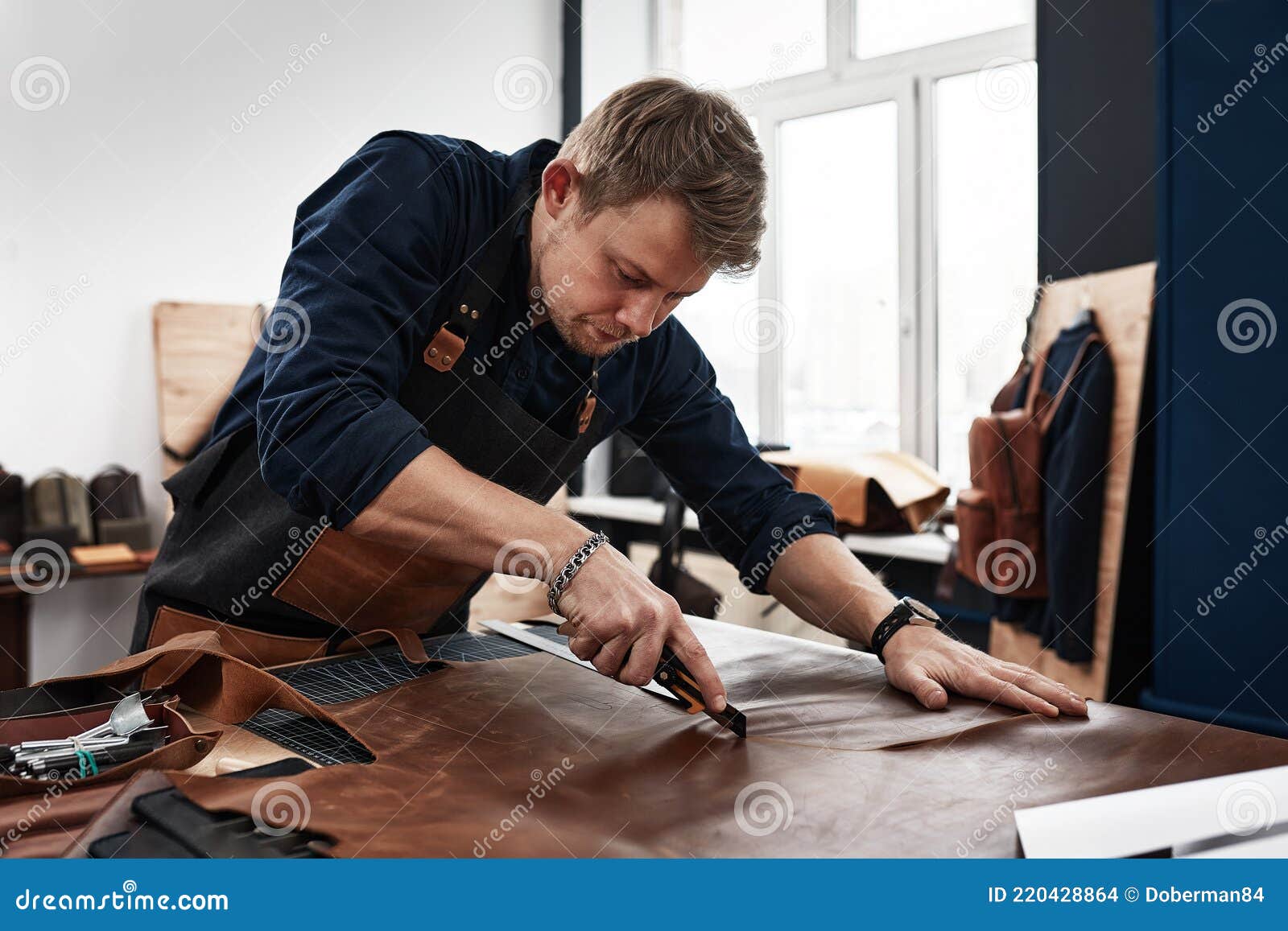 Leather Craftsmen Working Making in Patterns at Table in