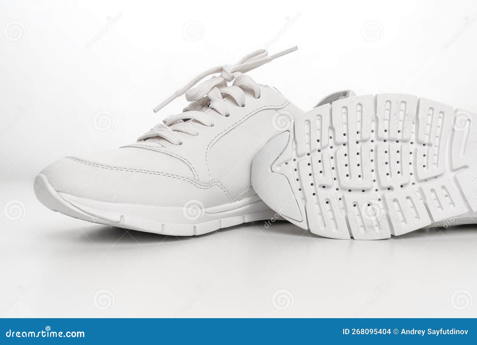 Leather Sneakers with Lacing and Perforated Sole on a White Background ...