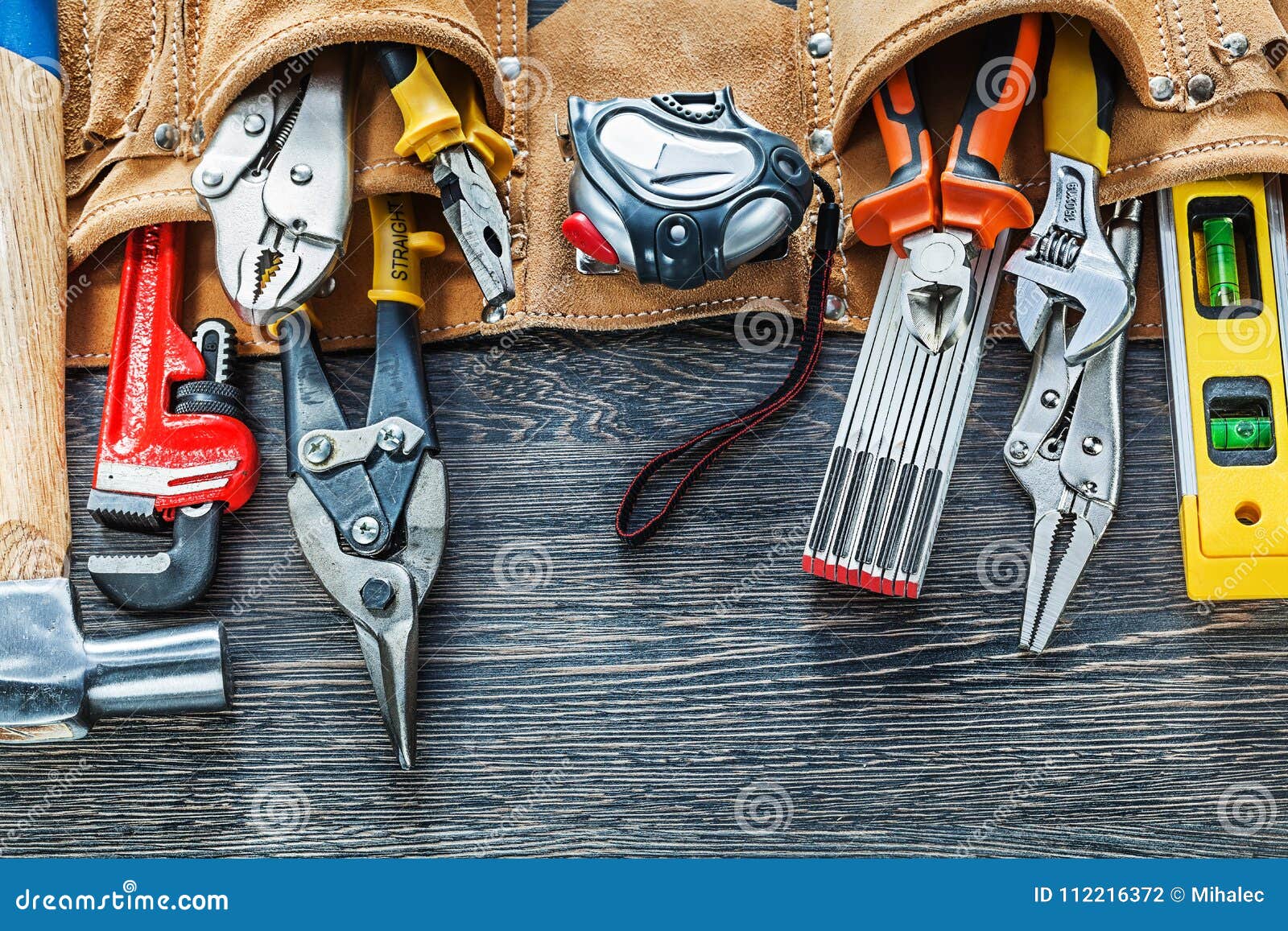 Leather Tool Belt Construction Tooling on Wooden Board Stock Photo
