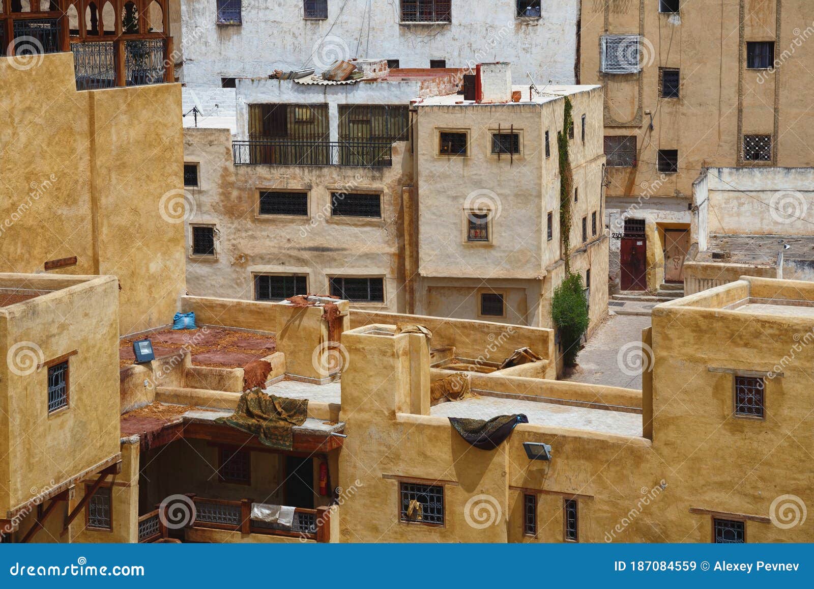the leathers are dried on the roofs of the old tannery buildings in fez. morocco. the tanning industry in the city is considered