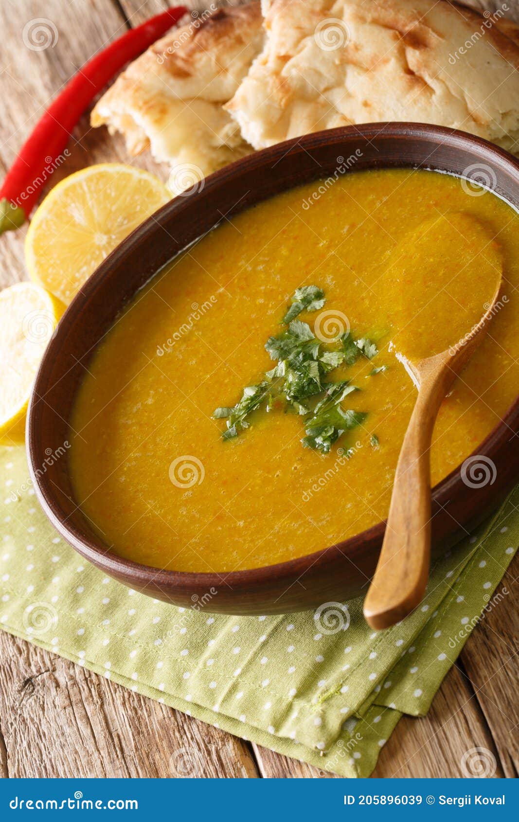 lebanese lentil soup shorbat adas closeup in the bowl. vertical