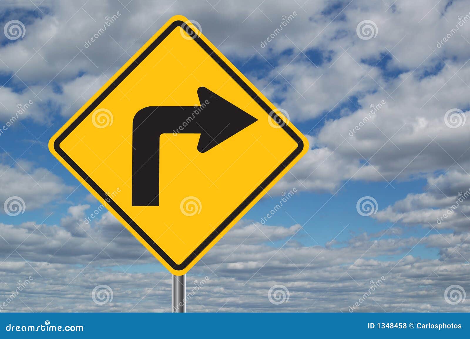 left turn traffic sign with clouds