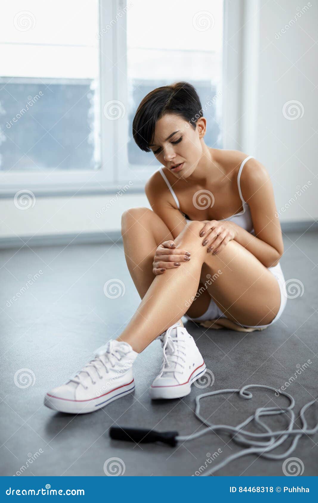 Leg Injury. Beautiful Woman Feeling Pain in Knee, Painful Knee Stock Photo of discomfort, beautiful: 84468318