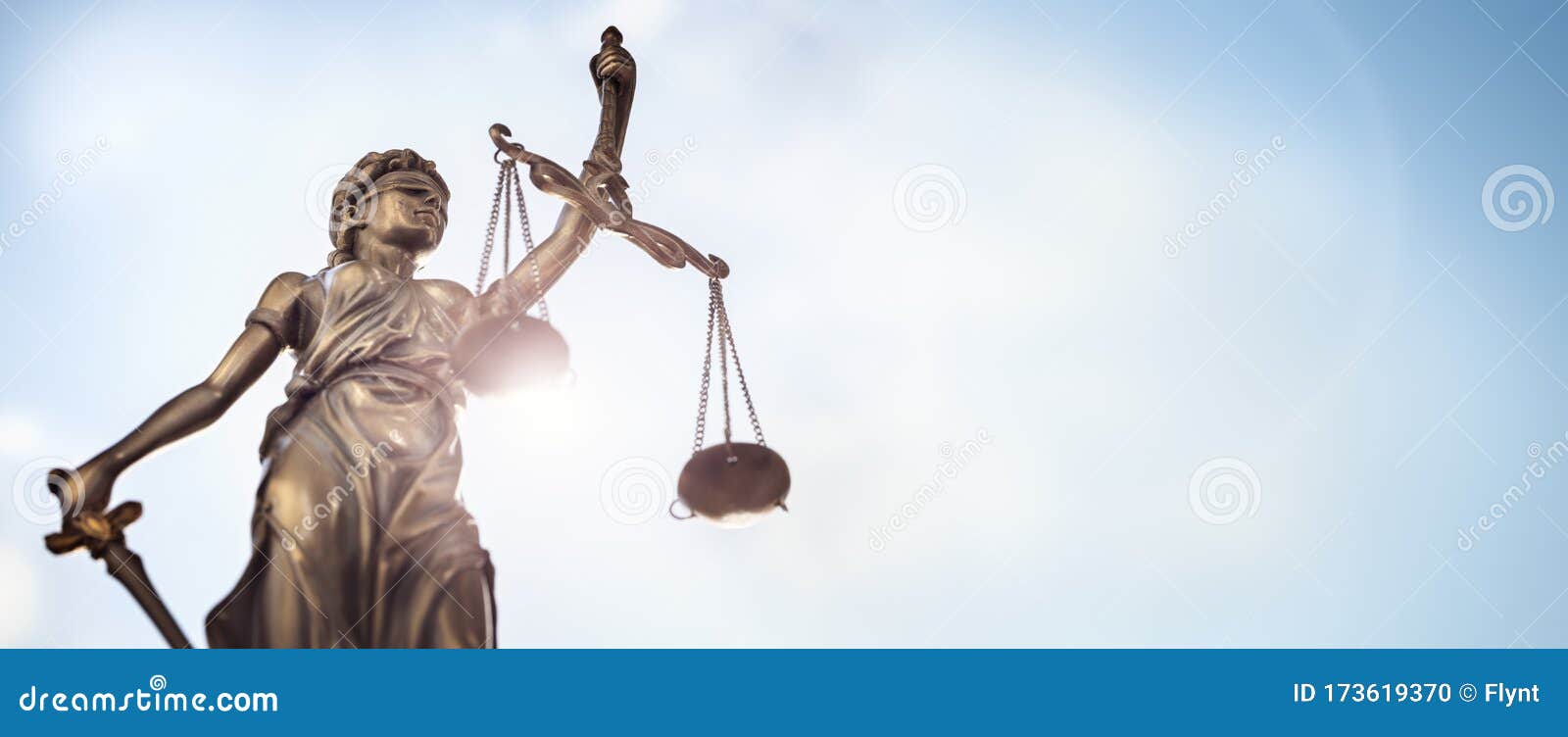 legal law concept statue of lady justice with scales of justice sky background