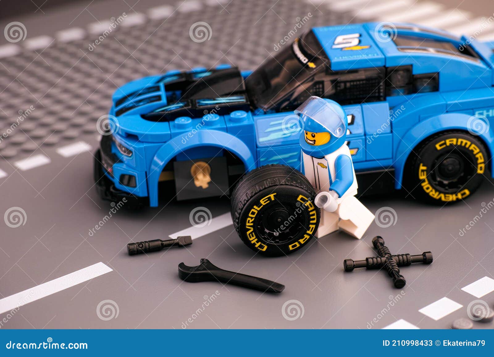 Lego Driver Minifigure Fixing Wheel of Chevrolet Camaro ZL1 Race Car by LEGO  Speed Champions. Road Baseplate Background Editorial Stock Photo - Image of  brick, repairing: 210998433