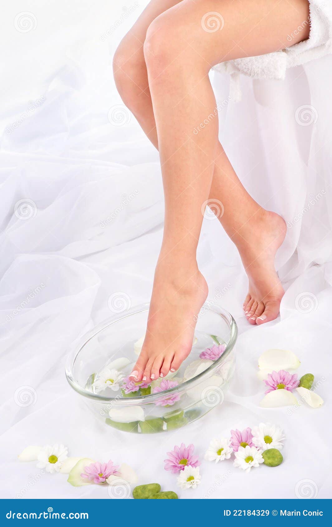 Legs in aromatherapy bowl stock image. Image of petal 22184329